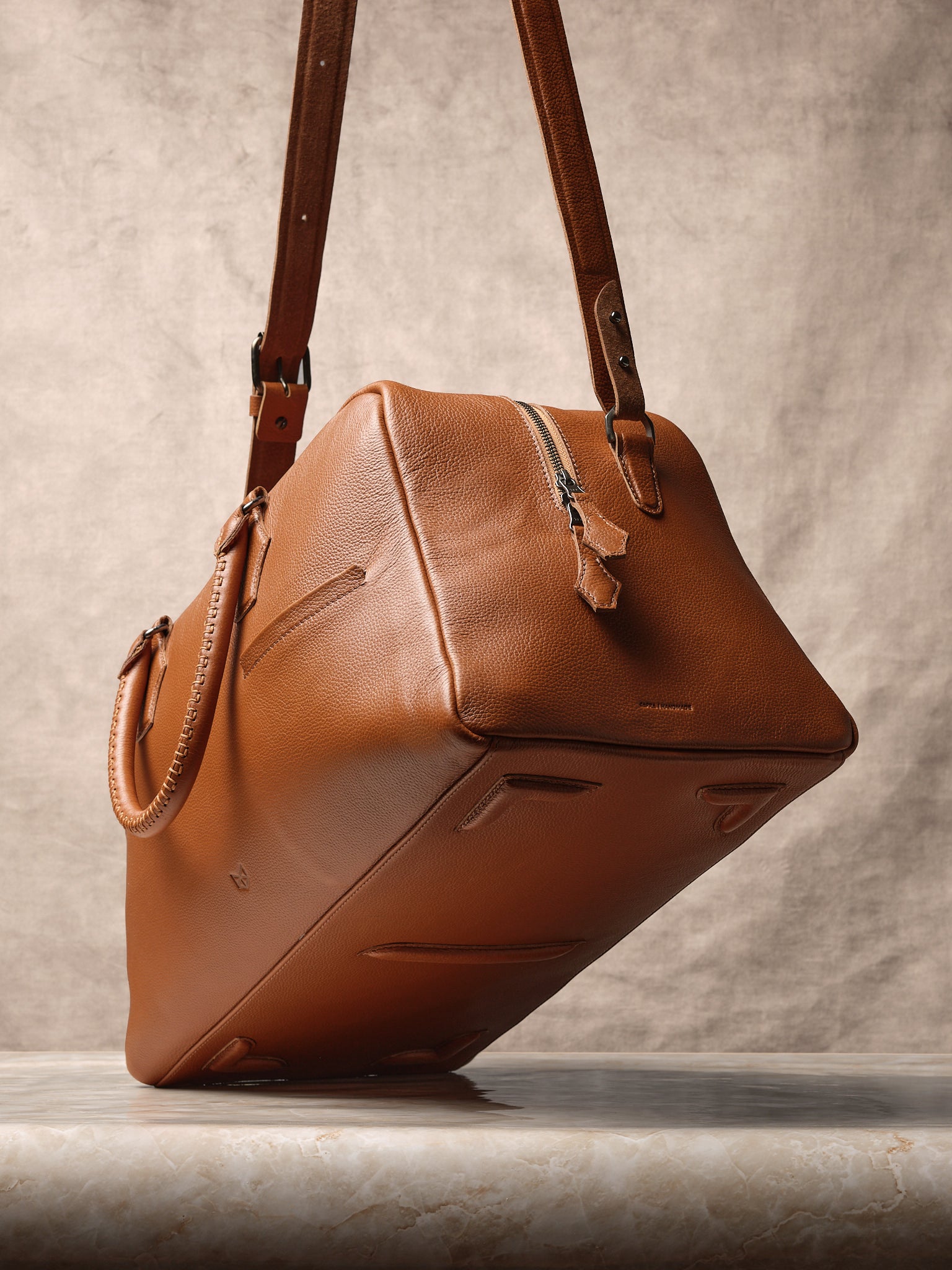 Elegant Leather Feet. Designer Duffle Bag Tan by Capra Leather