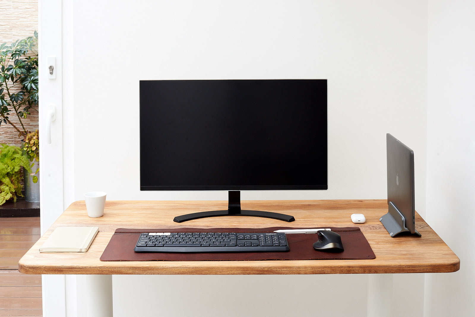 Sleek leather desk pad offering a refined writing surface.