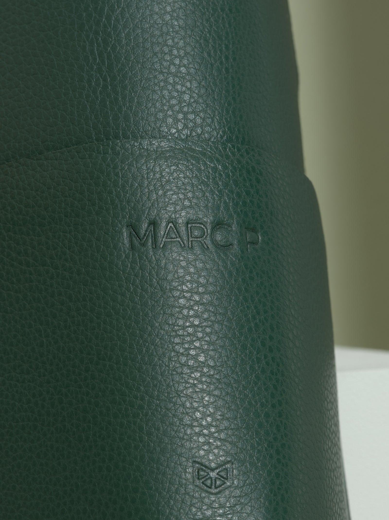 Green leather glasses case with a custom "marc p" monogram, a thoughtful personalized gift for men.