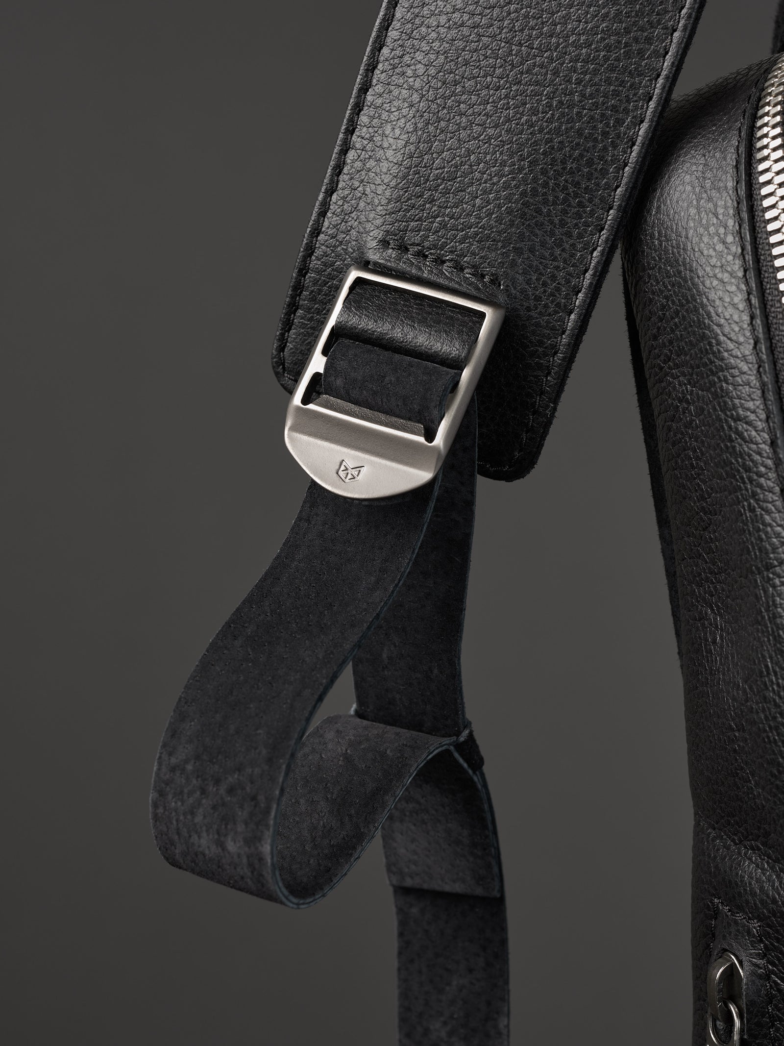 Hidden pocket in the back for easy access. Soft finish made in suede and leather. Premium materials. Double D Ring system for quick adjustments. Men's backpack for style and durability. Made in quality materials by Capra Leather.