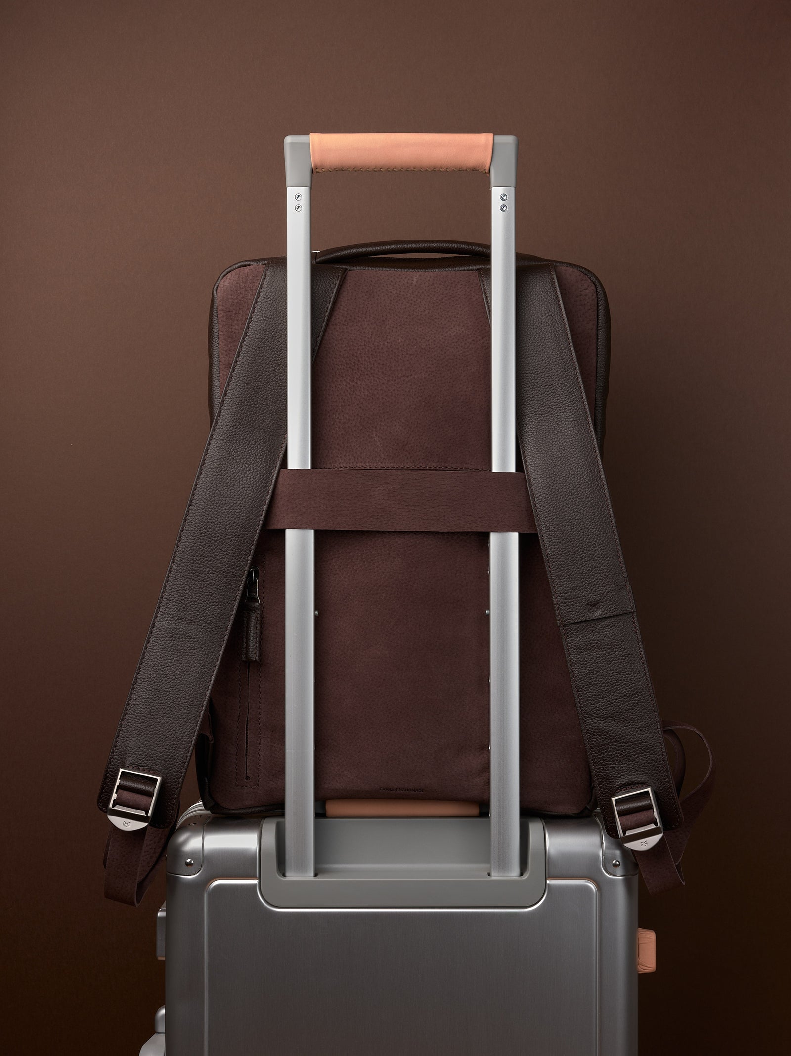 Suede and leather backpack made for men. Soft finish in leather. Invisible luggage strap for easy travel on plane. Comfortable and soft feeling. Premium materials. Made in leather by Capra Leather.