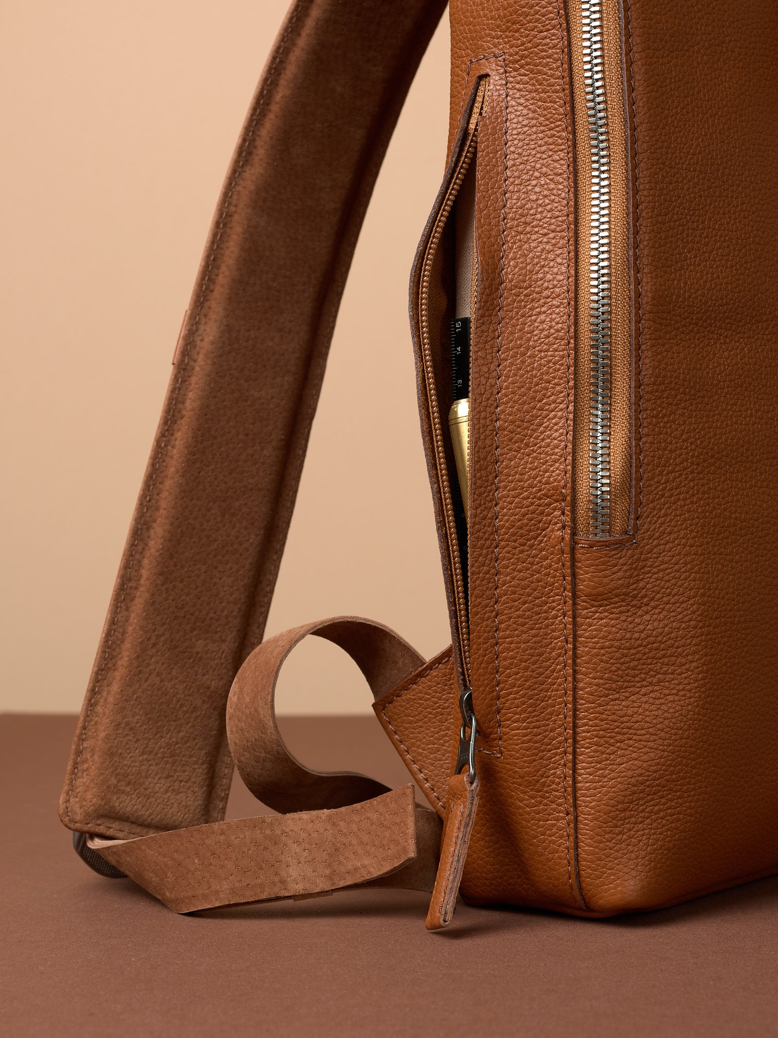 Professional backpack for men. Men's style. Men's fashion. Premium backpack for men. Side pocket for easy access. Everyday backpack. Padded shoulder straps for comfort. Memory foam padded strap for men. Quality materials for durability and style. Made in leather and suede by Capra Leather.