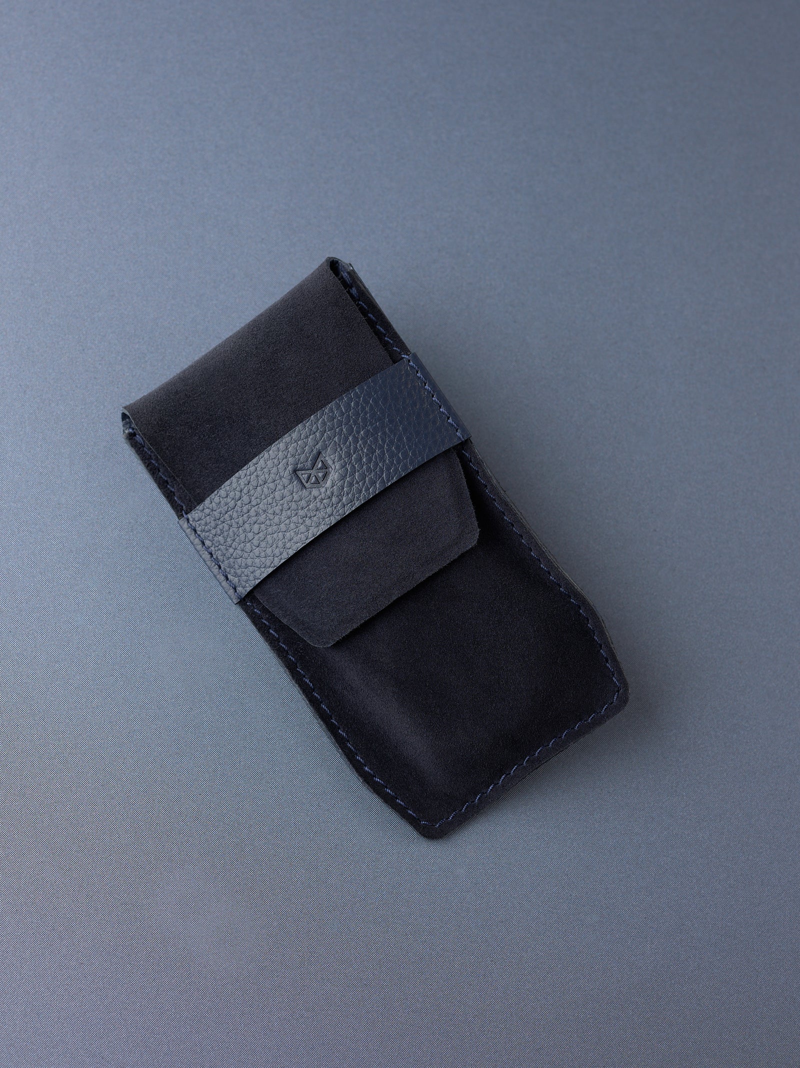 Capra Leather navy suede watch pouch with a distinctive leather strap made for men.