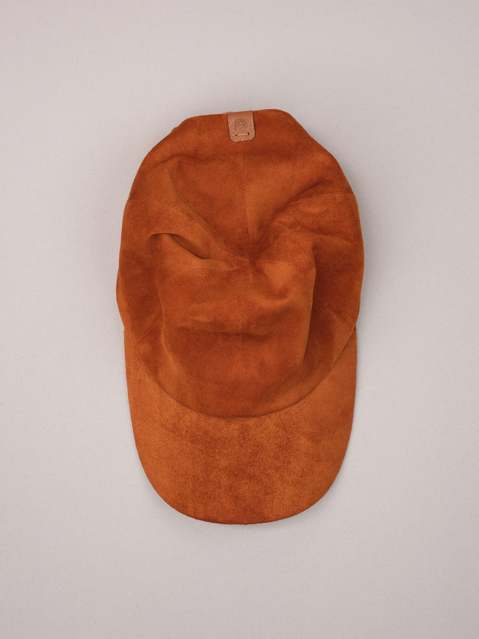 Handmade tan suede baseball cap.