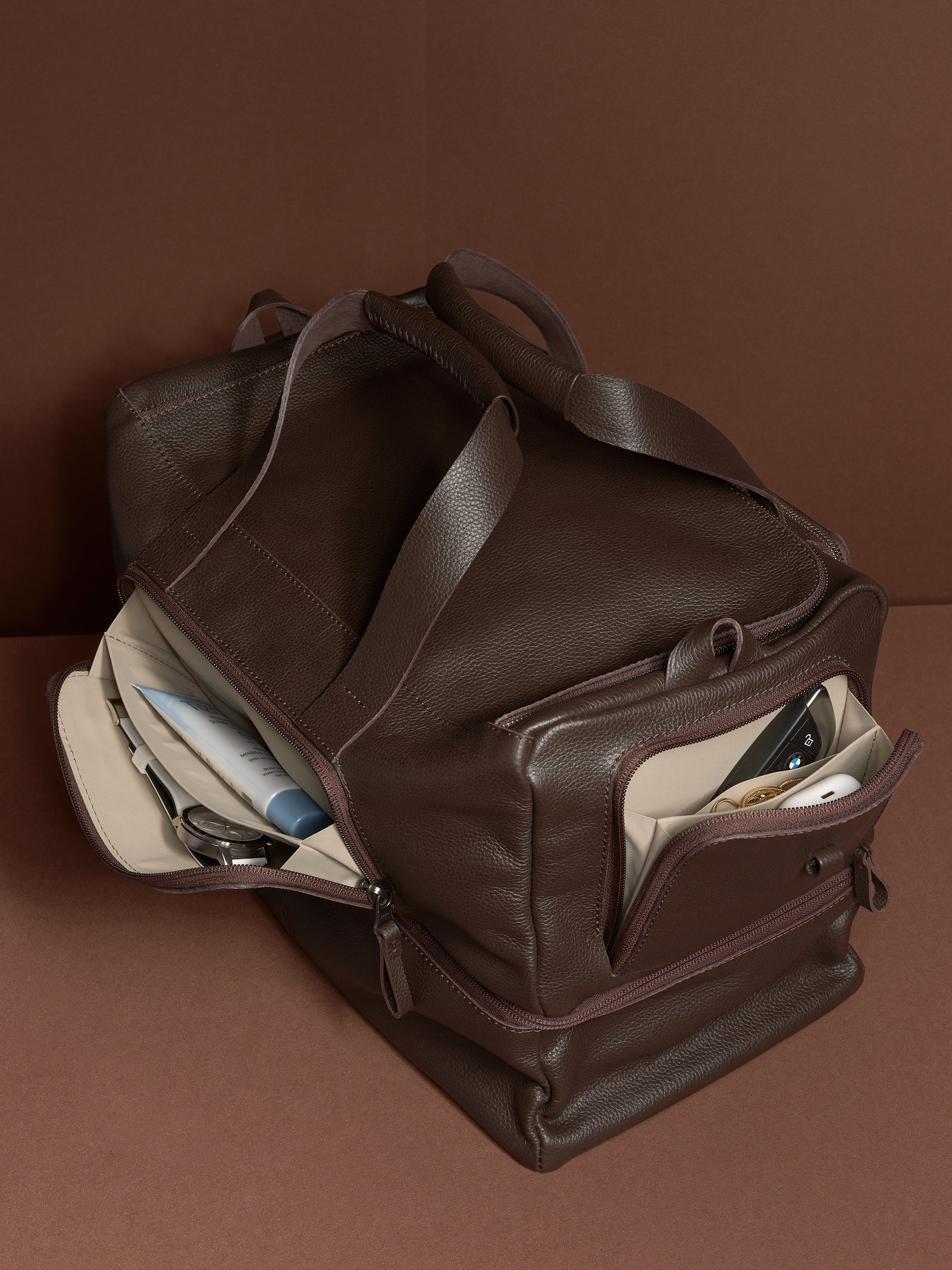 Ventra Holdall bag open, showing the main and side compartments filled with daily essentials.
