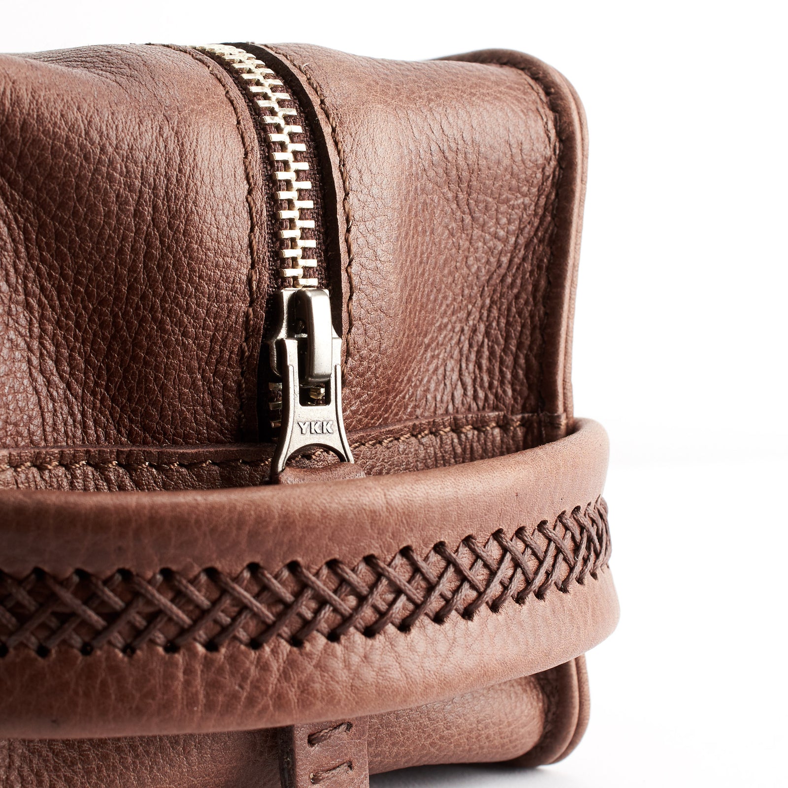 Close up. Brown leather toiletry, shaving bag with hand stitched handle