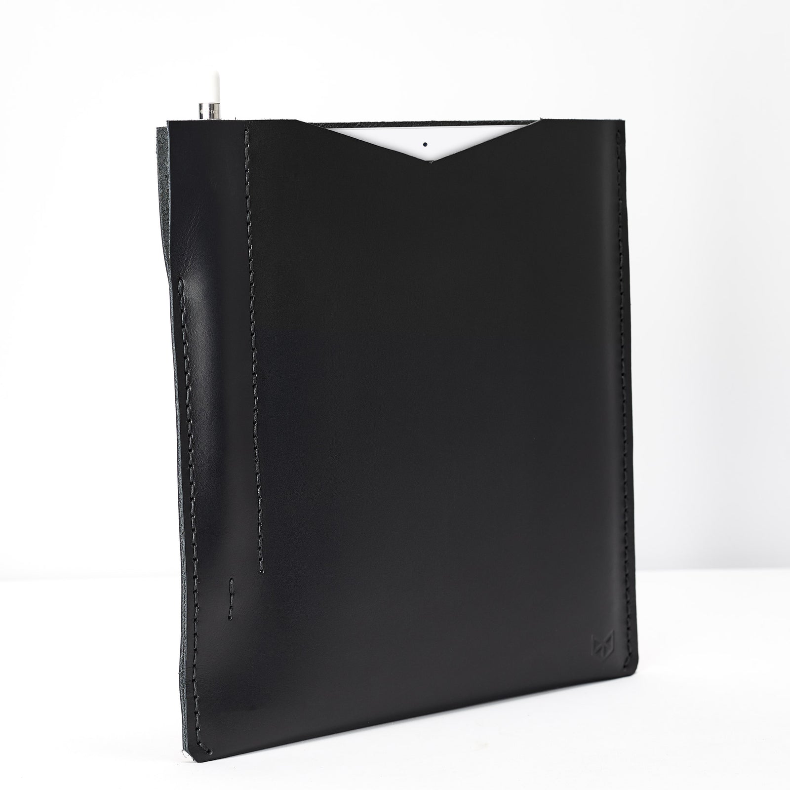 Side from the slim iPad pro sleeve. Black iPad pro leather sleeve with apple pencil holder
