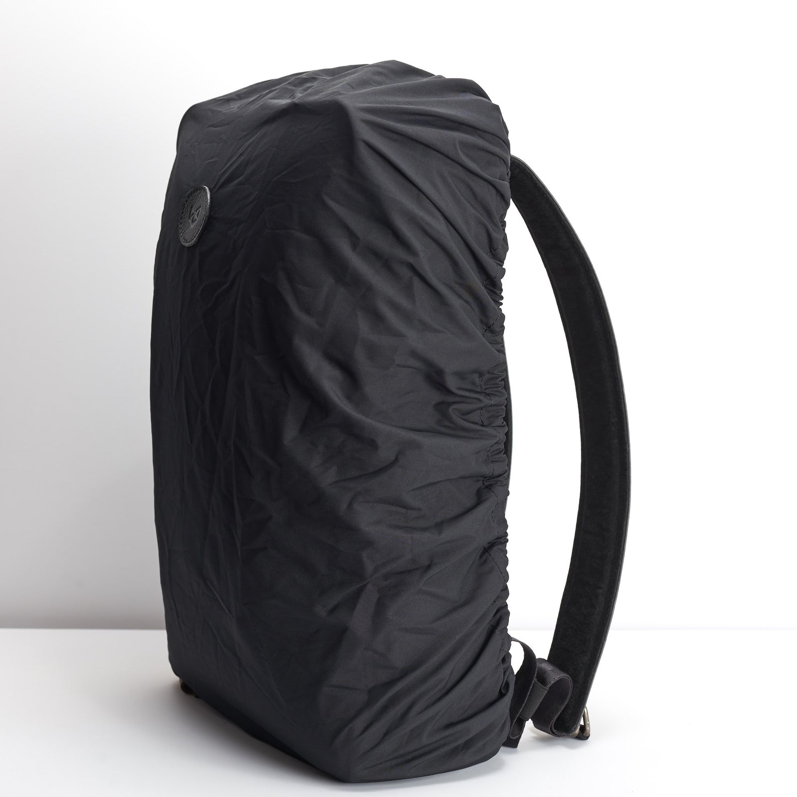 Black rain cover backpack accessory. Waterproof cape for Capra backpacks