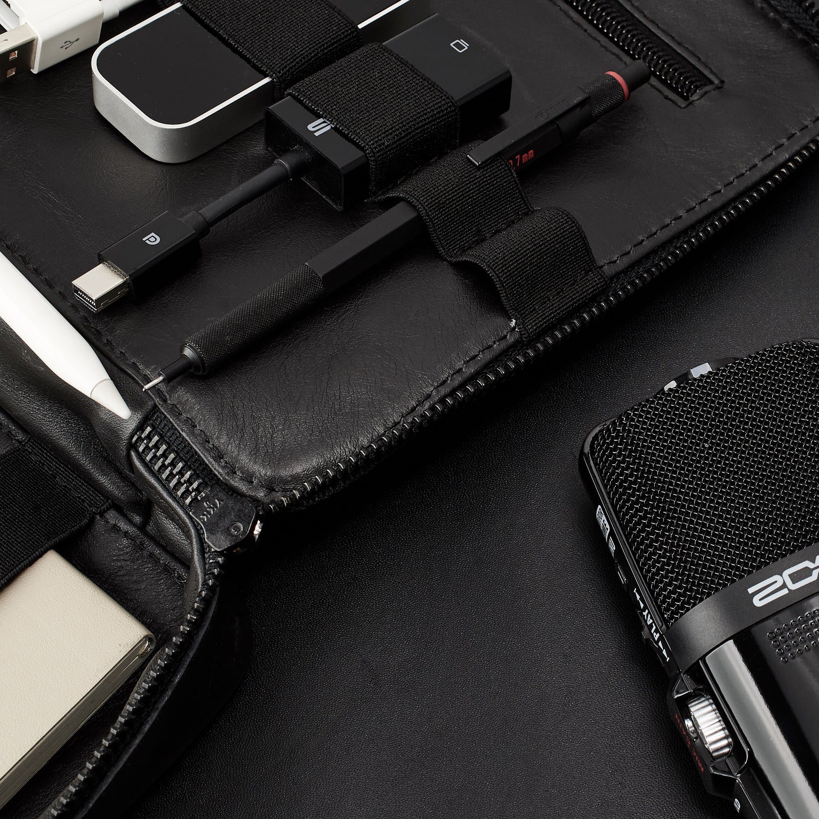 Black tech organizer pouch by Capra Leather. Fits iPad Pro with Apple pencil.