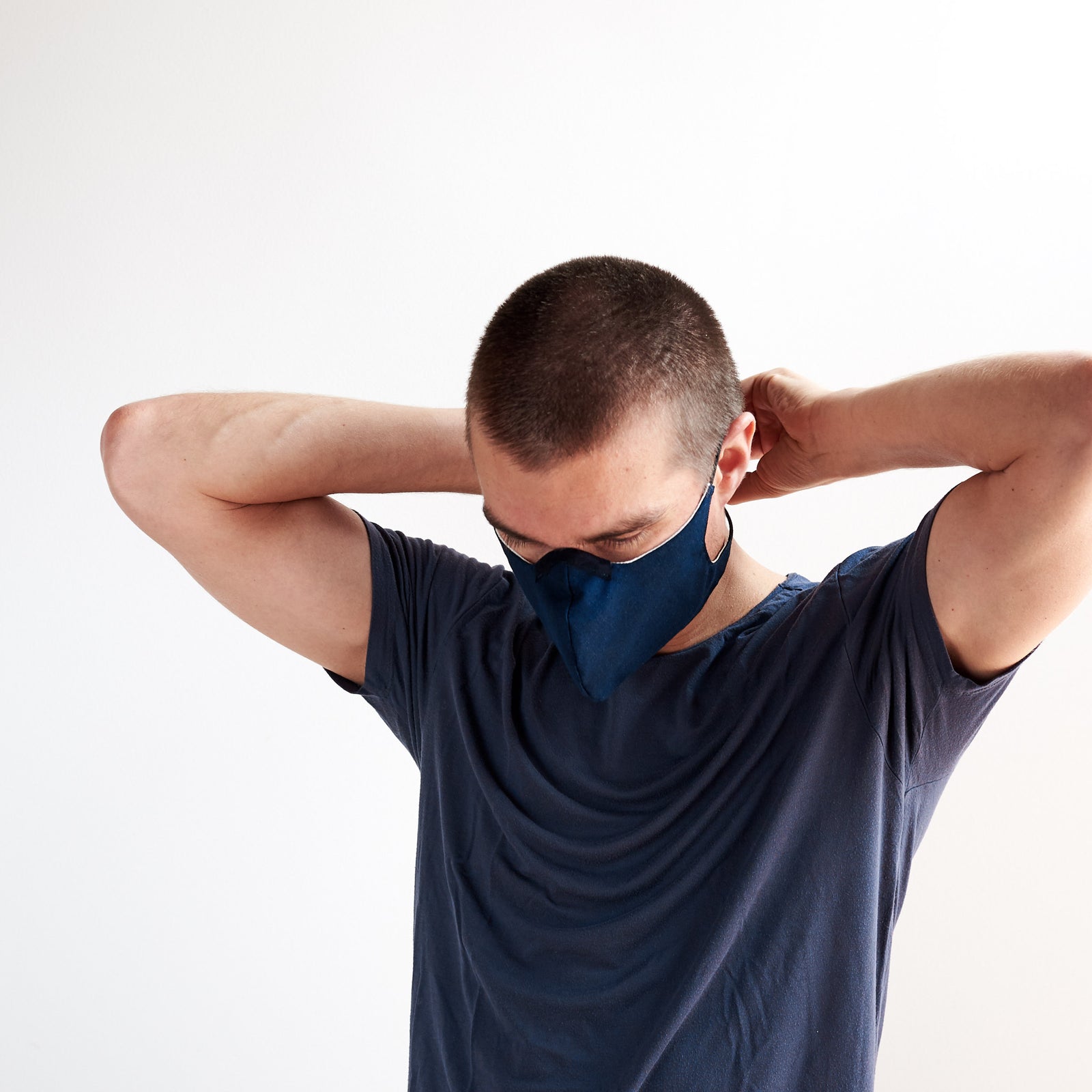 Side view. Blue reusable Adult & Kid Face Mask by Capra Leather