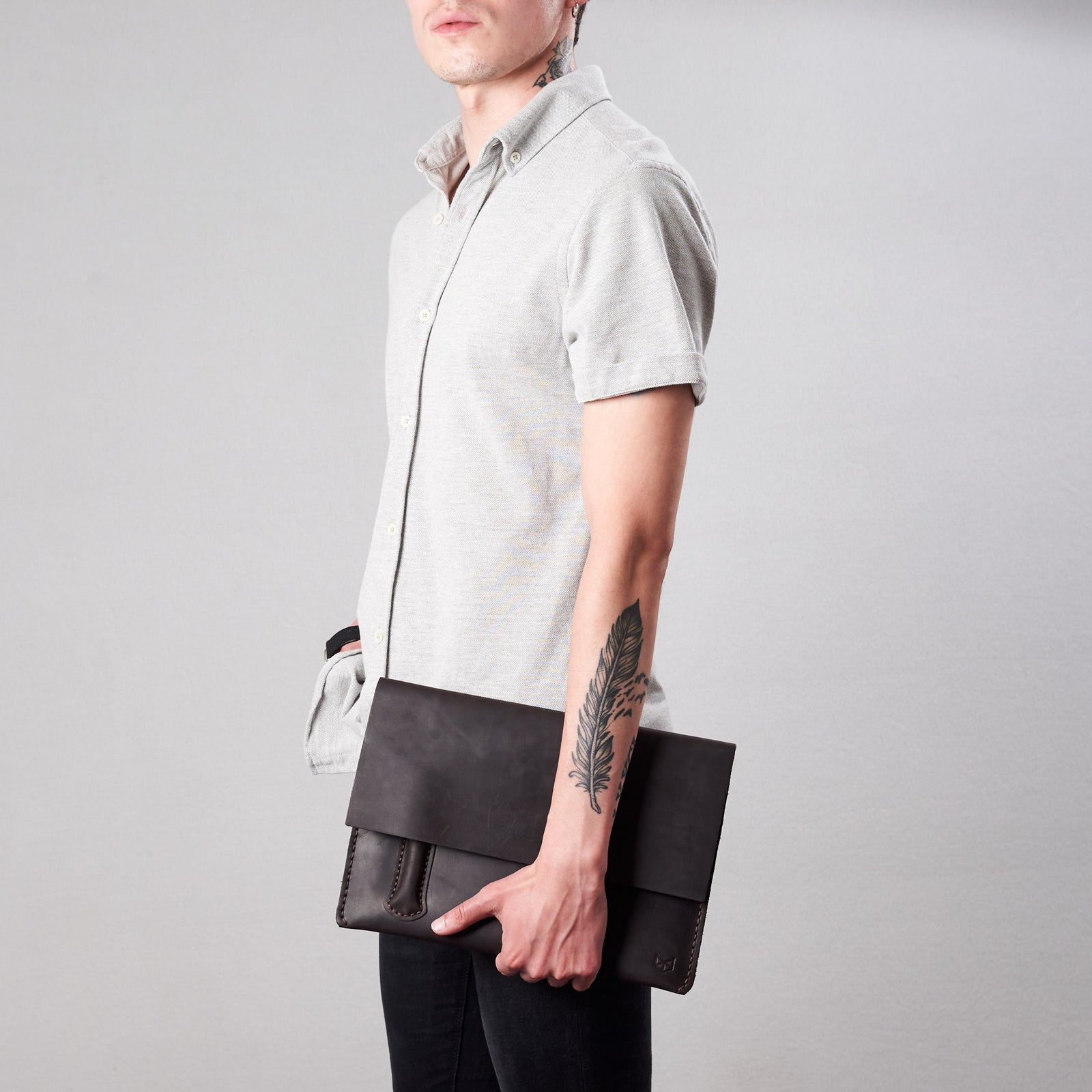 Style hold by model. Marron draftsman 2 case by Capra Leather. Microsoft Surface sleeve.