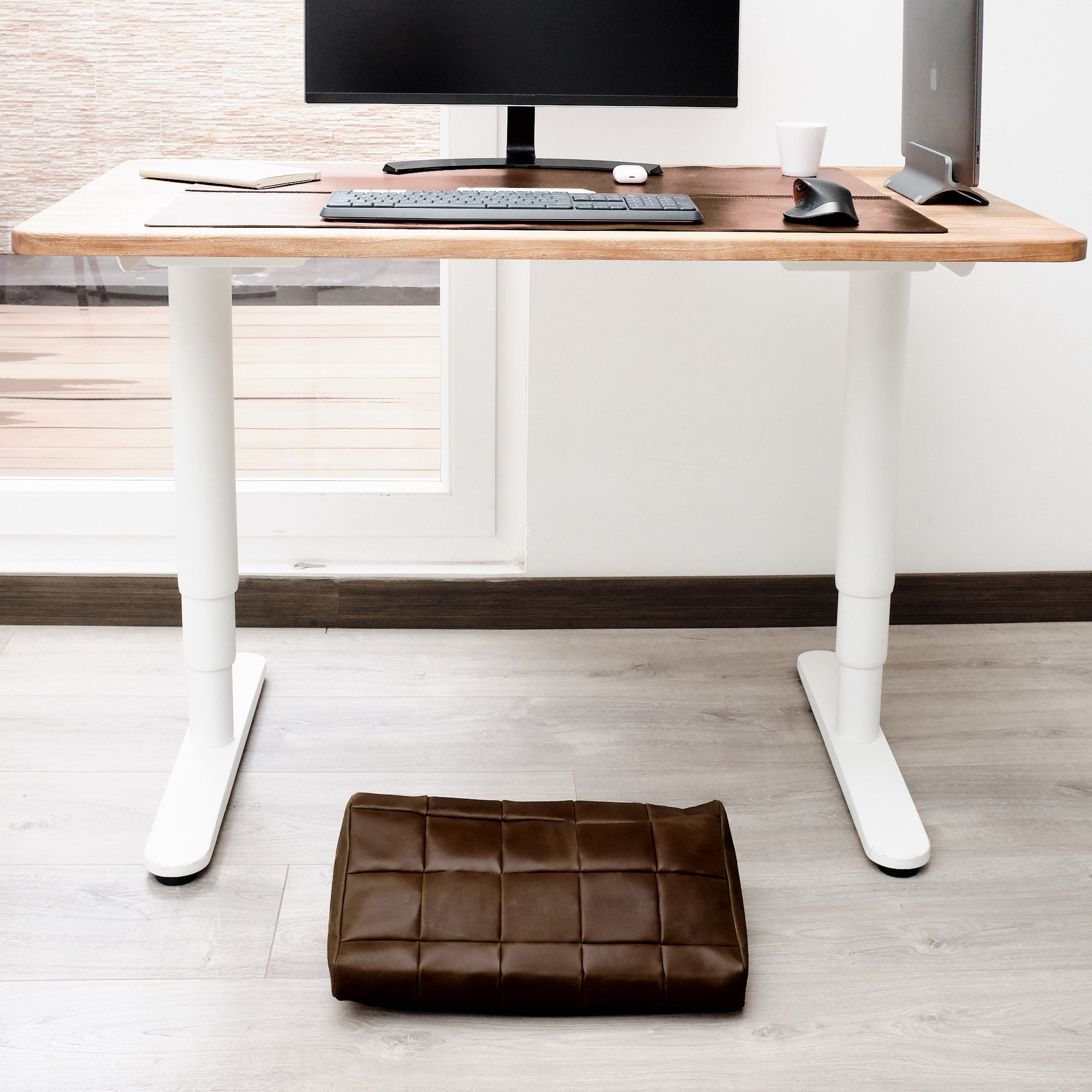 Cover. Ergonomic under desk footrest cover in brown by Capra Leather