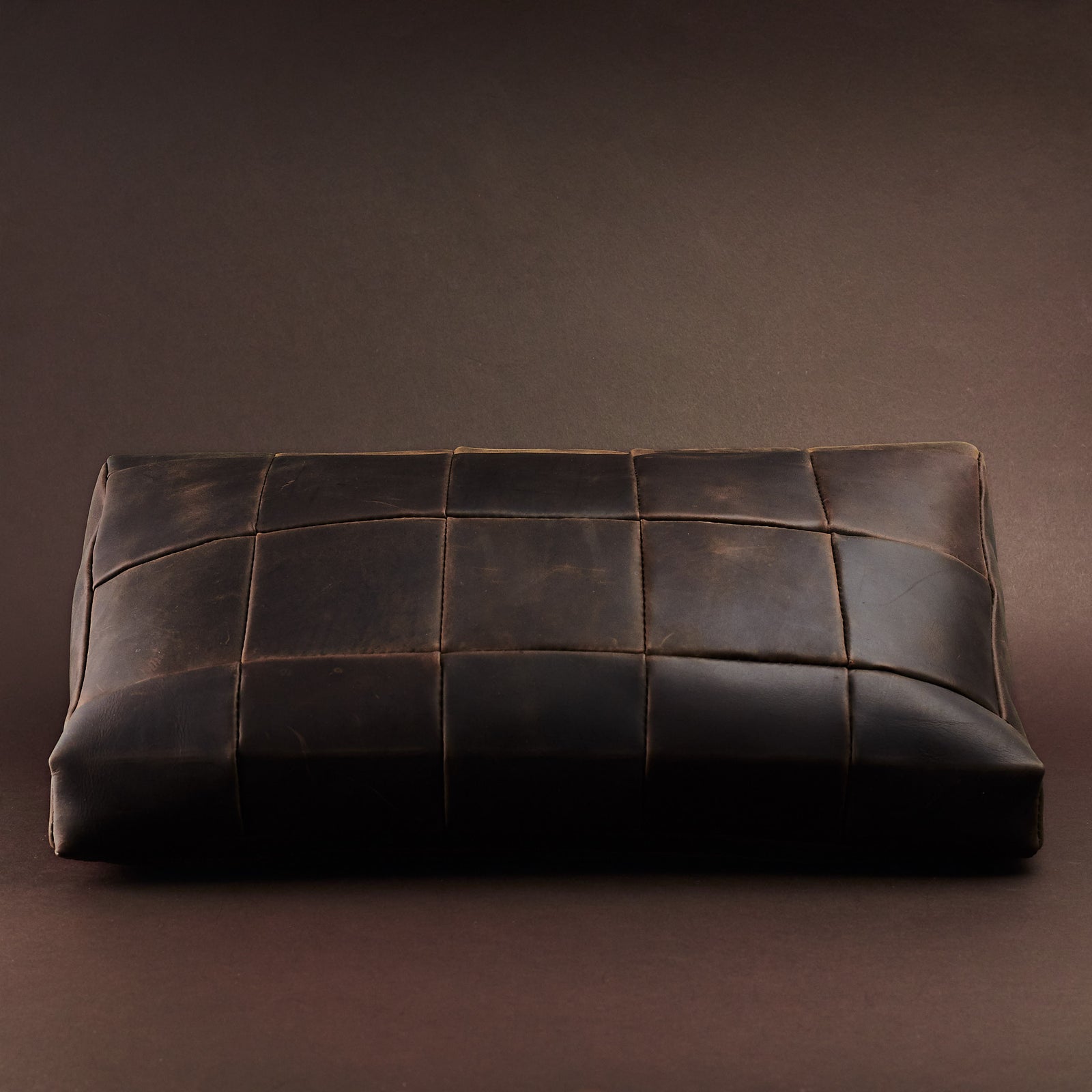 Front. Ergonomic under desk footrest cover in brown by Capra Leather