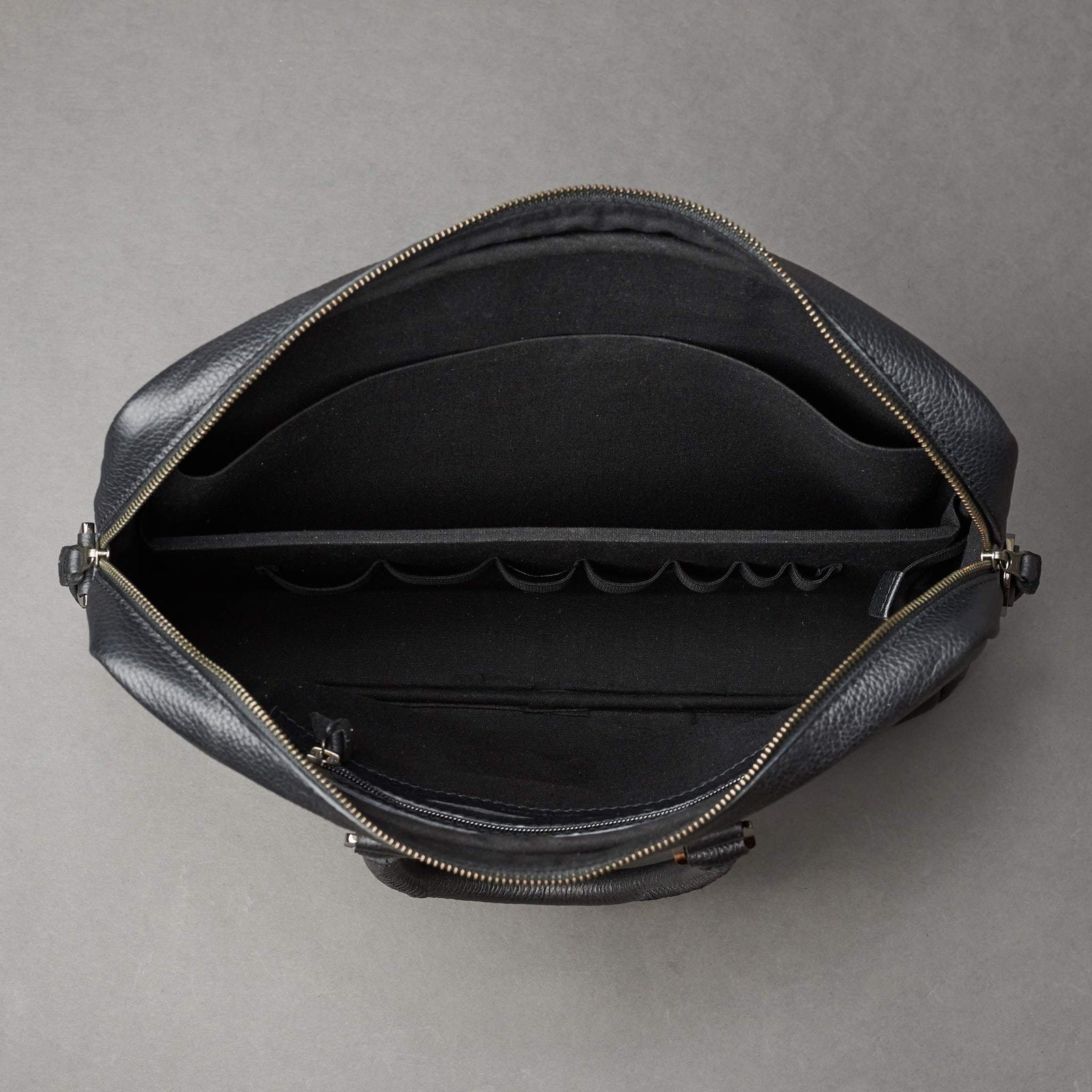 Interior with 7 division slots .Black leather briefcase laptop bag for men. Gazeli laptop briefcase by Capra Leather.