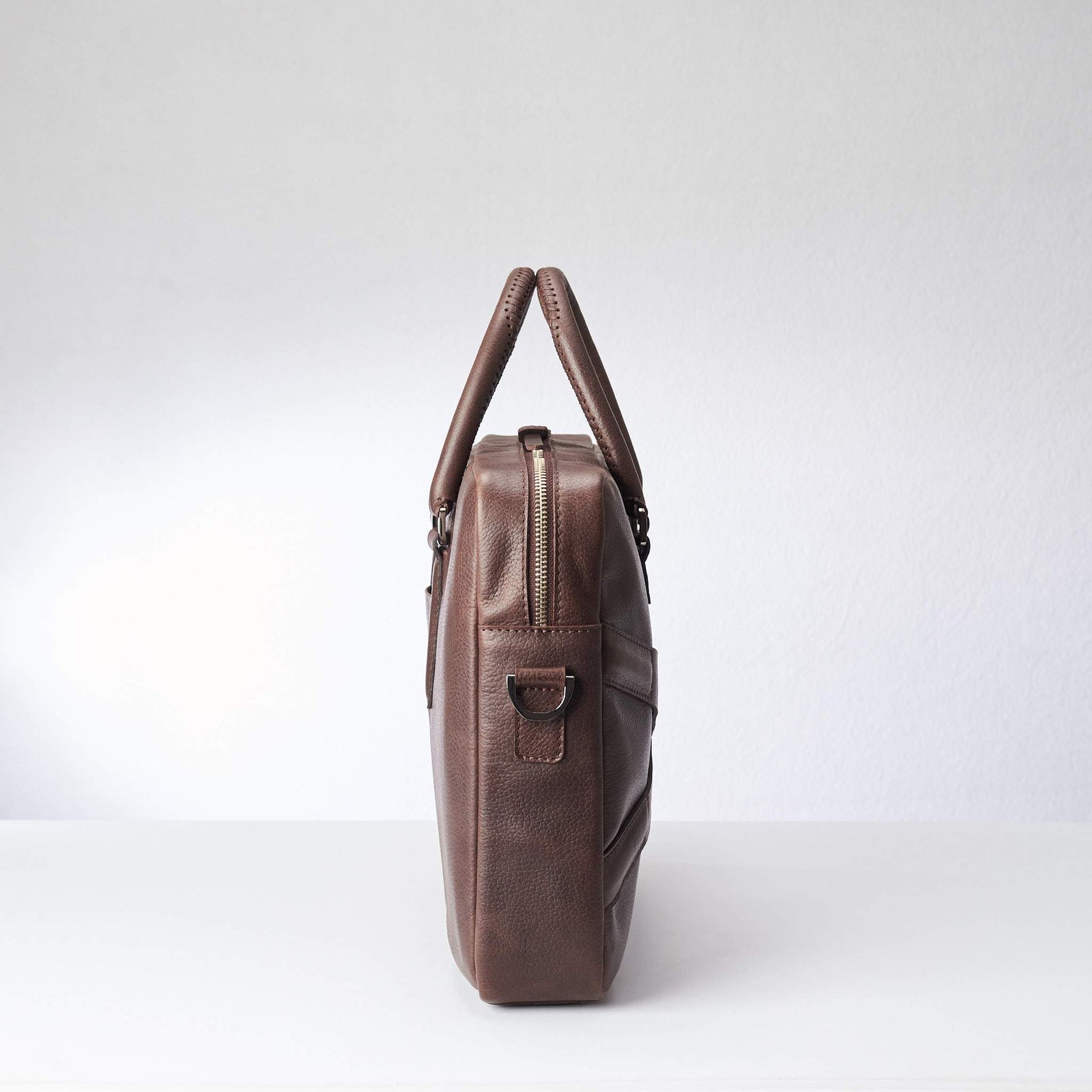 Side view of soft office and workbag .Dark Brown leather briefcase laptop bag for men. Gazeli laptop briefcase by Capra Leather.
