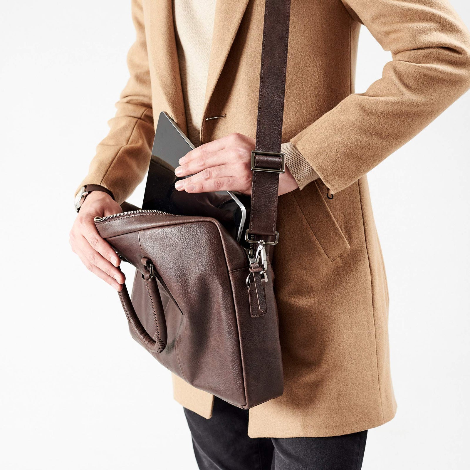 iPad inside briefcase detail with model. Dark Brown leather briefcase laptop bag for men. Gazeli laptop briefcase by Capra Leather.