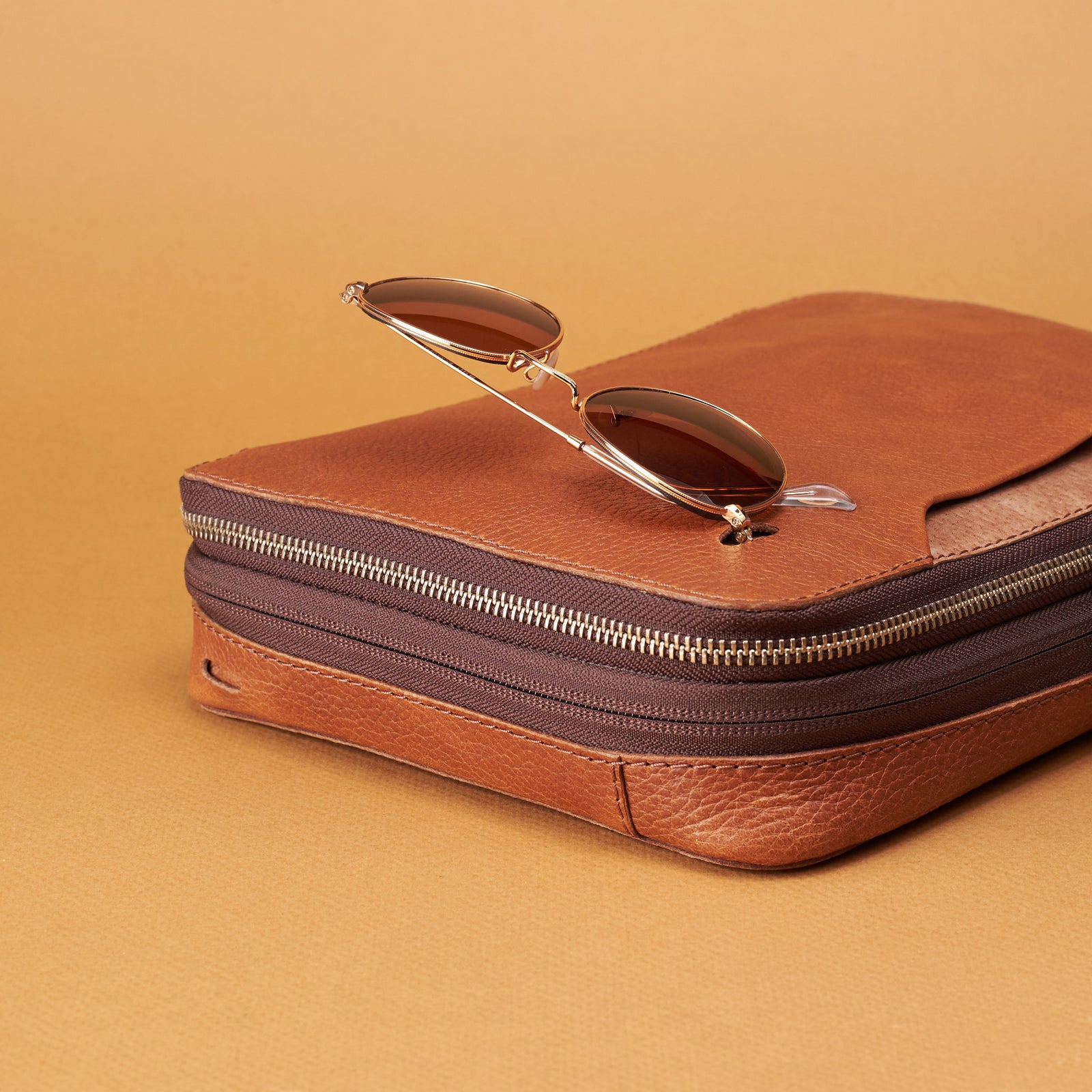 Quick access glasses holder. Tan travel electronics organizer by Capra Leather