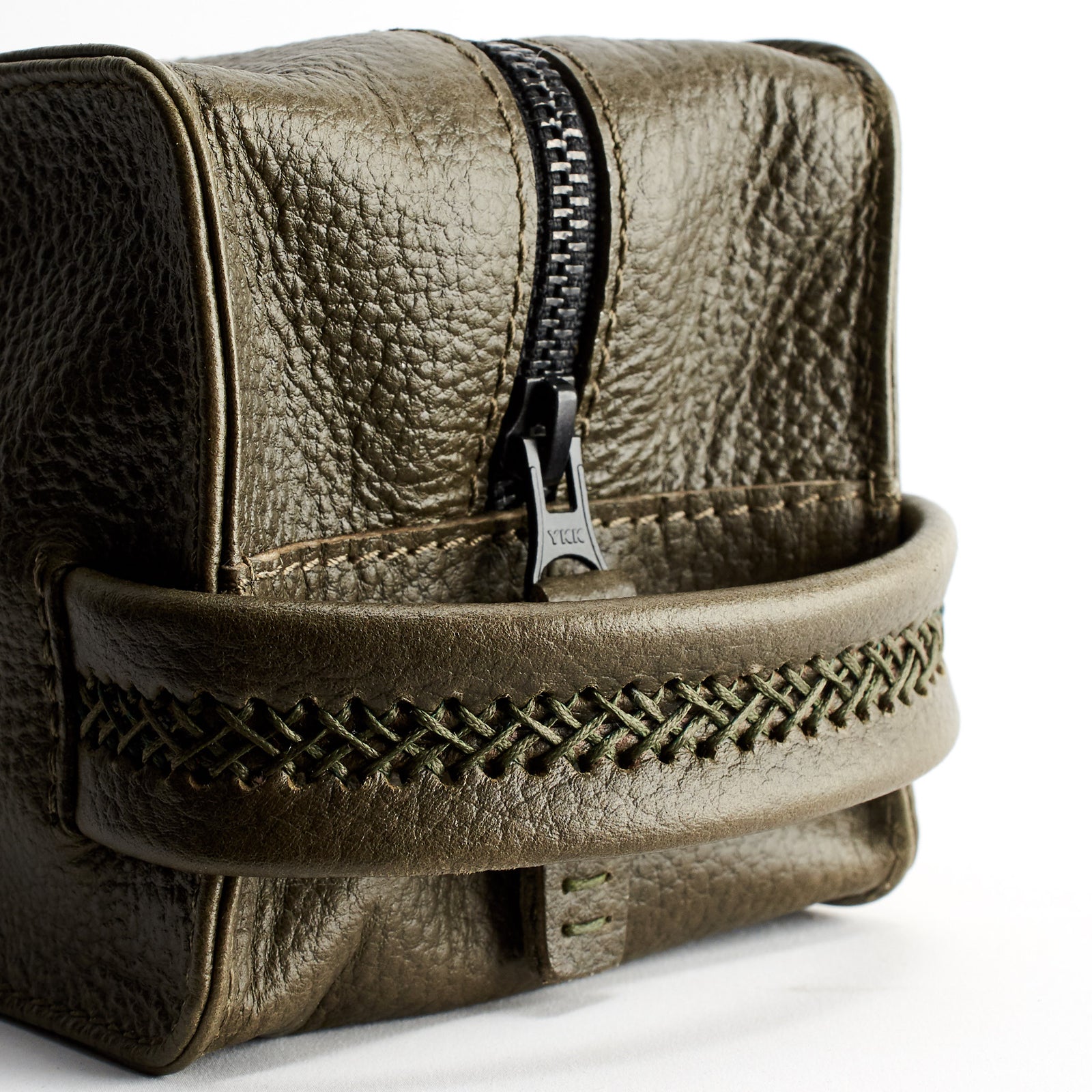 Hand stitch detail. Green leather toiletry, shaving bag with hand stitched handle. Groomsmen gifts