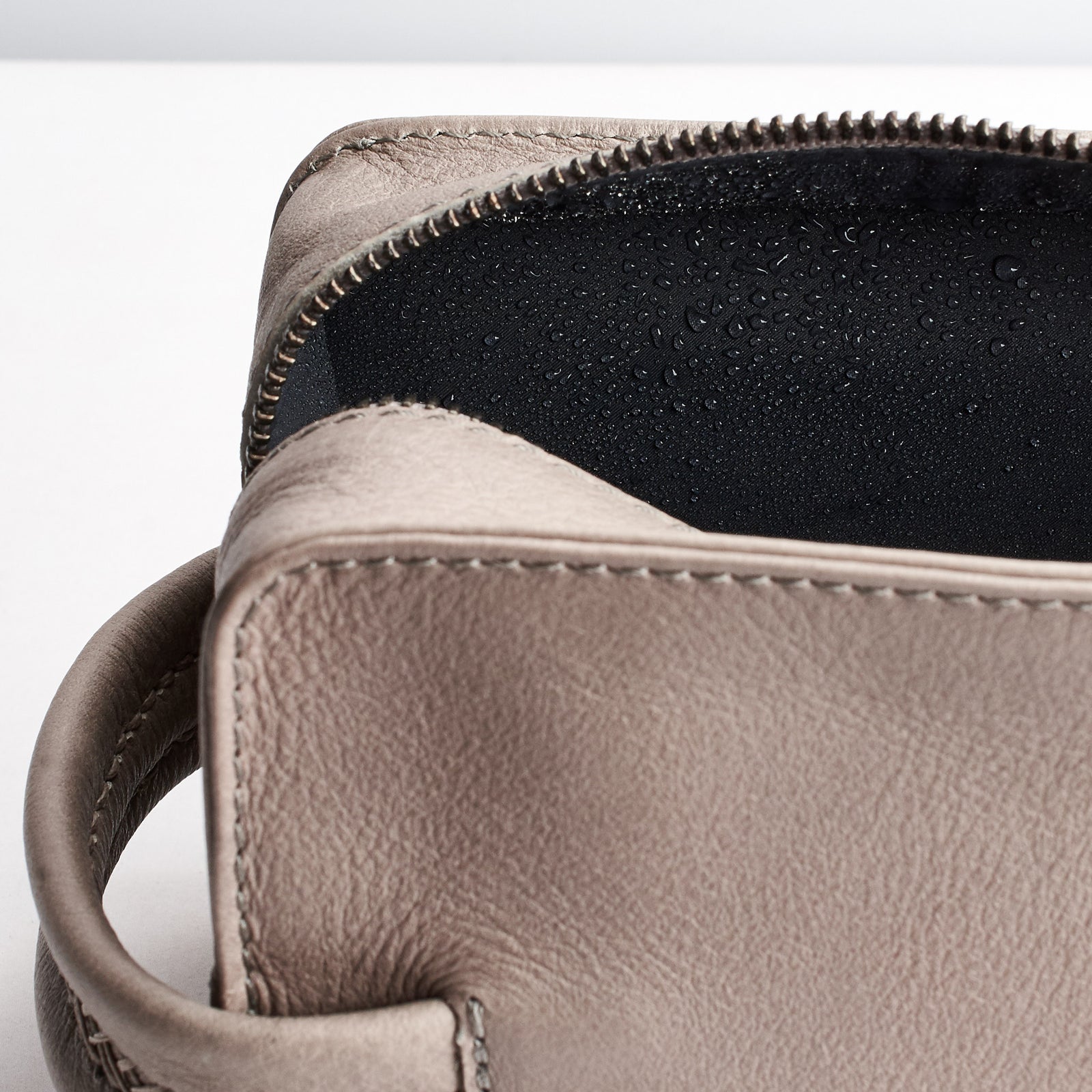 Water proof lining interior. Grey leather dopp kit. Mens toiletry bag for travel