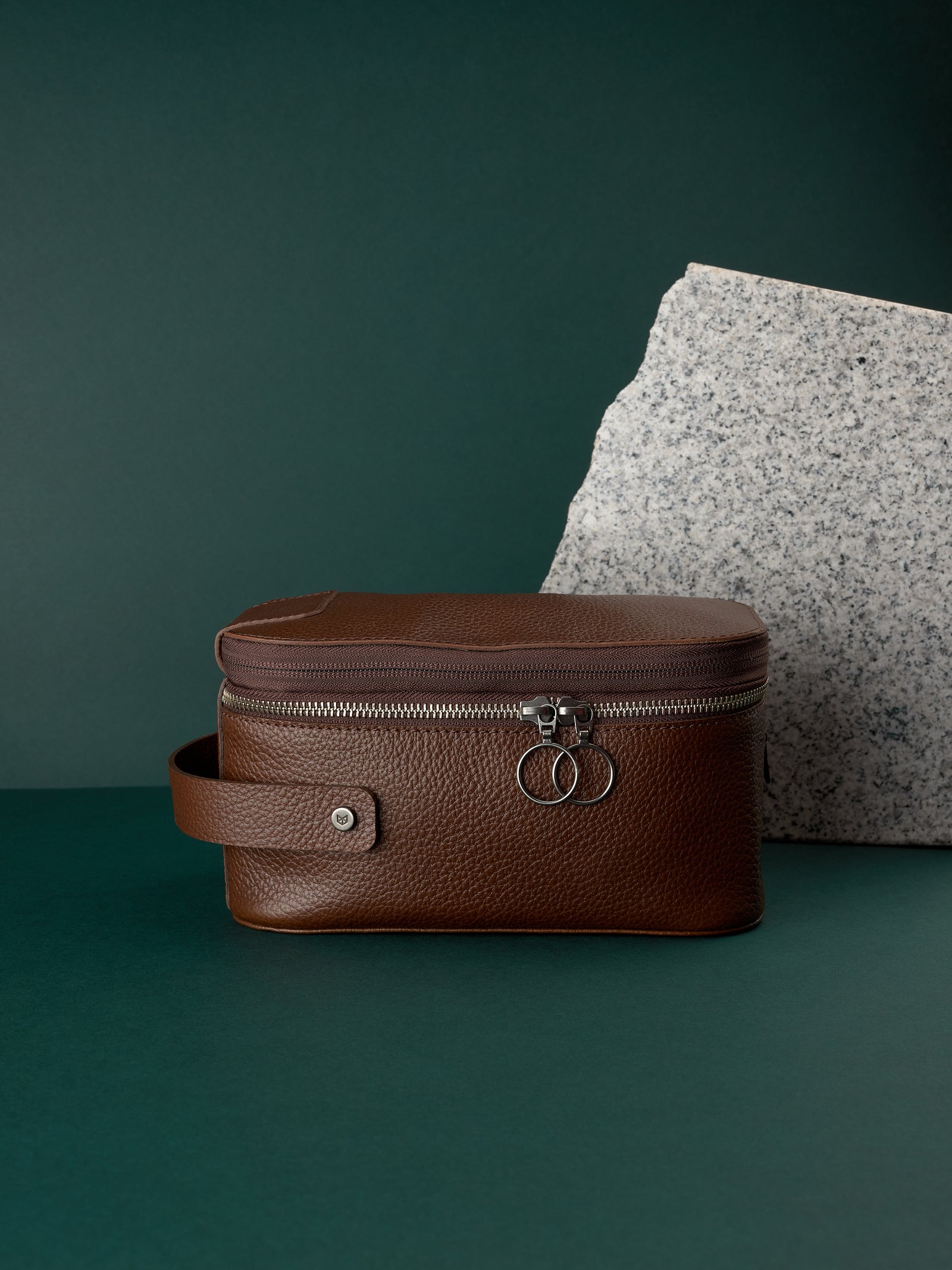 Brown leather toiletry bag by Capra