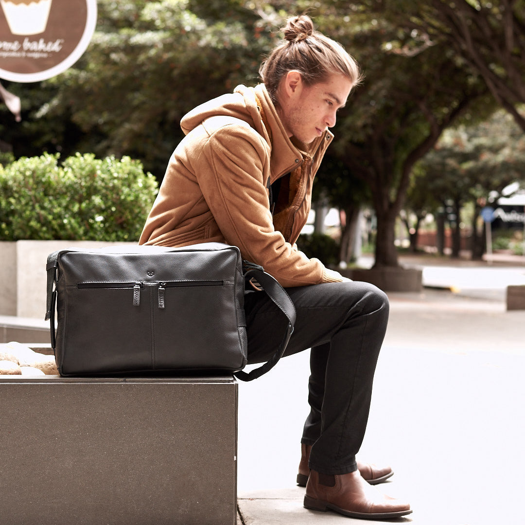 Street style. Black handmade leather messenger bag for men. Commuter bag, laptop leather bag by Capra Leather.