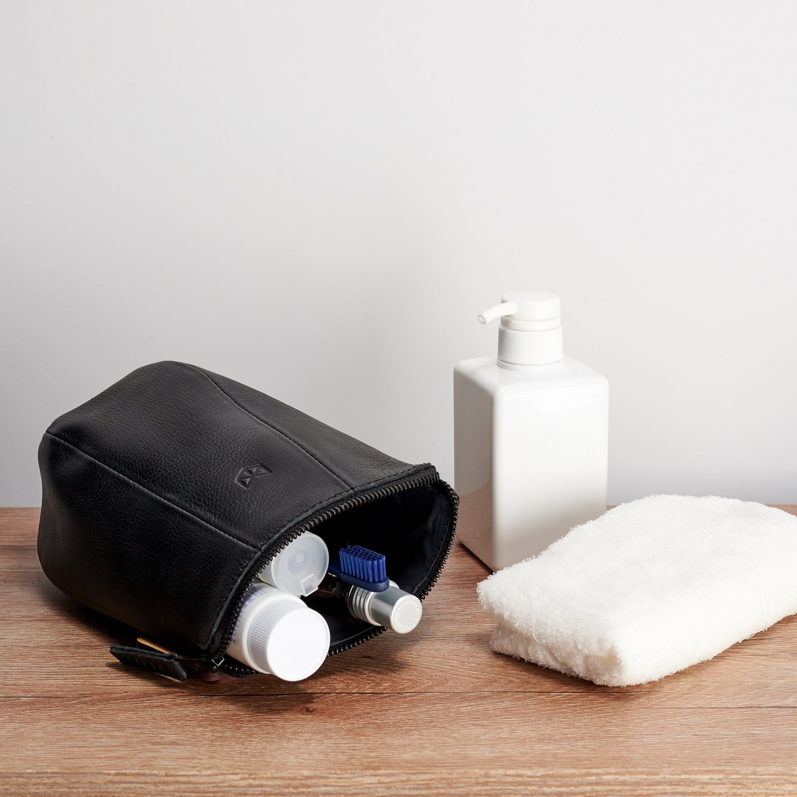 Travel Style photo. Black leather toiletry dopp kit for men. Custom gifts for men