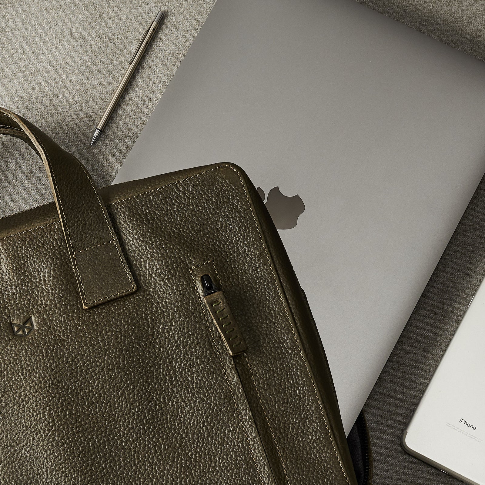 Style. Green leather briefcase for men. Office style mens workbag