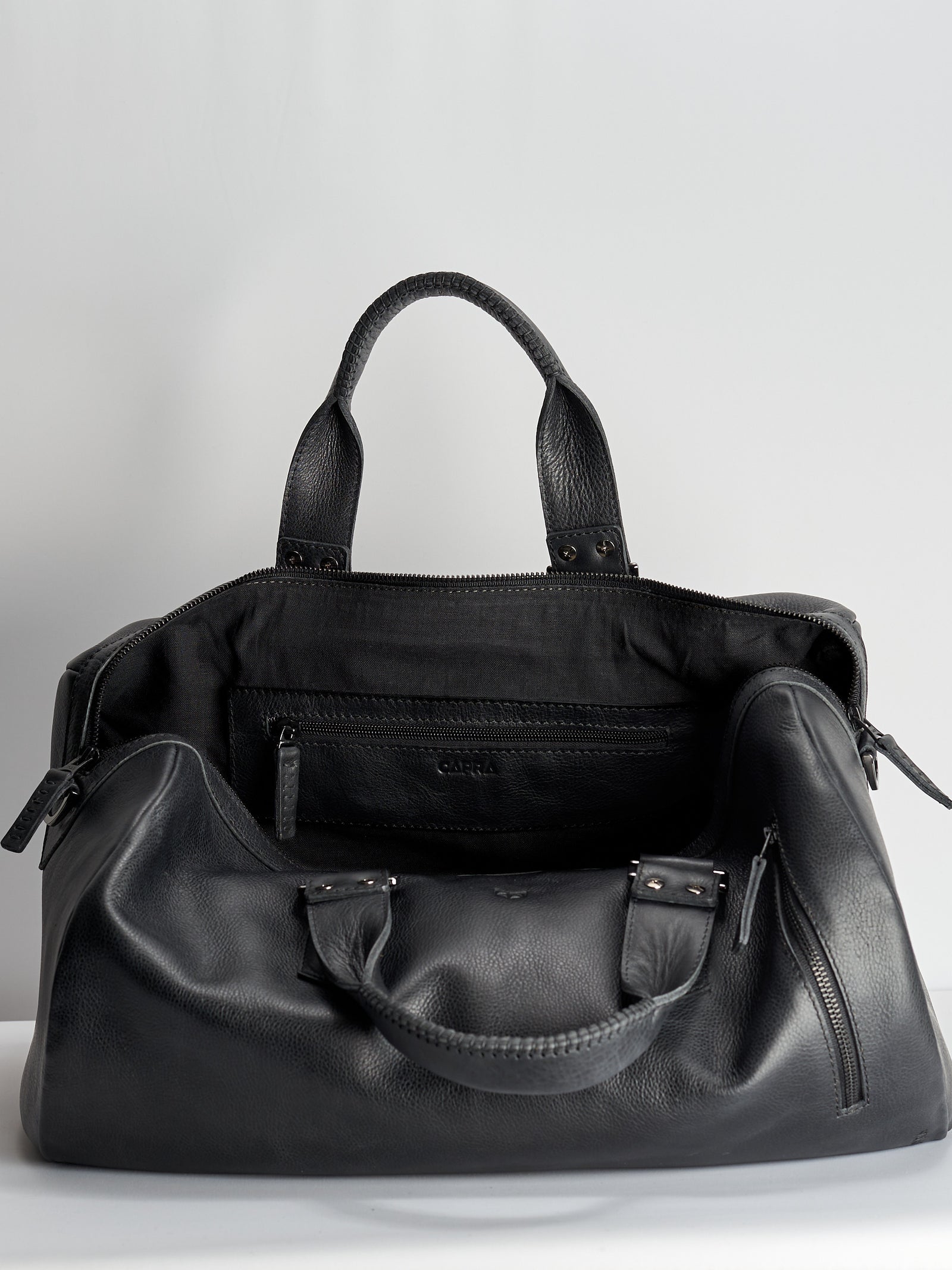 Linen interior. Black leather work out bag for men. Designer weekender travel bag