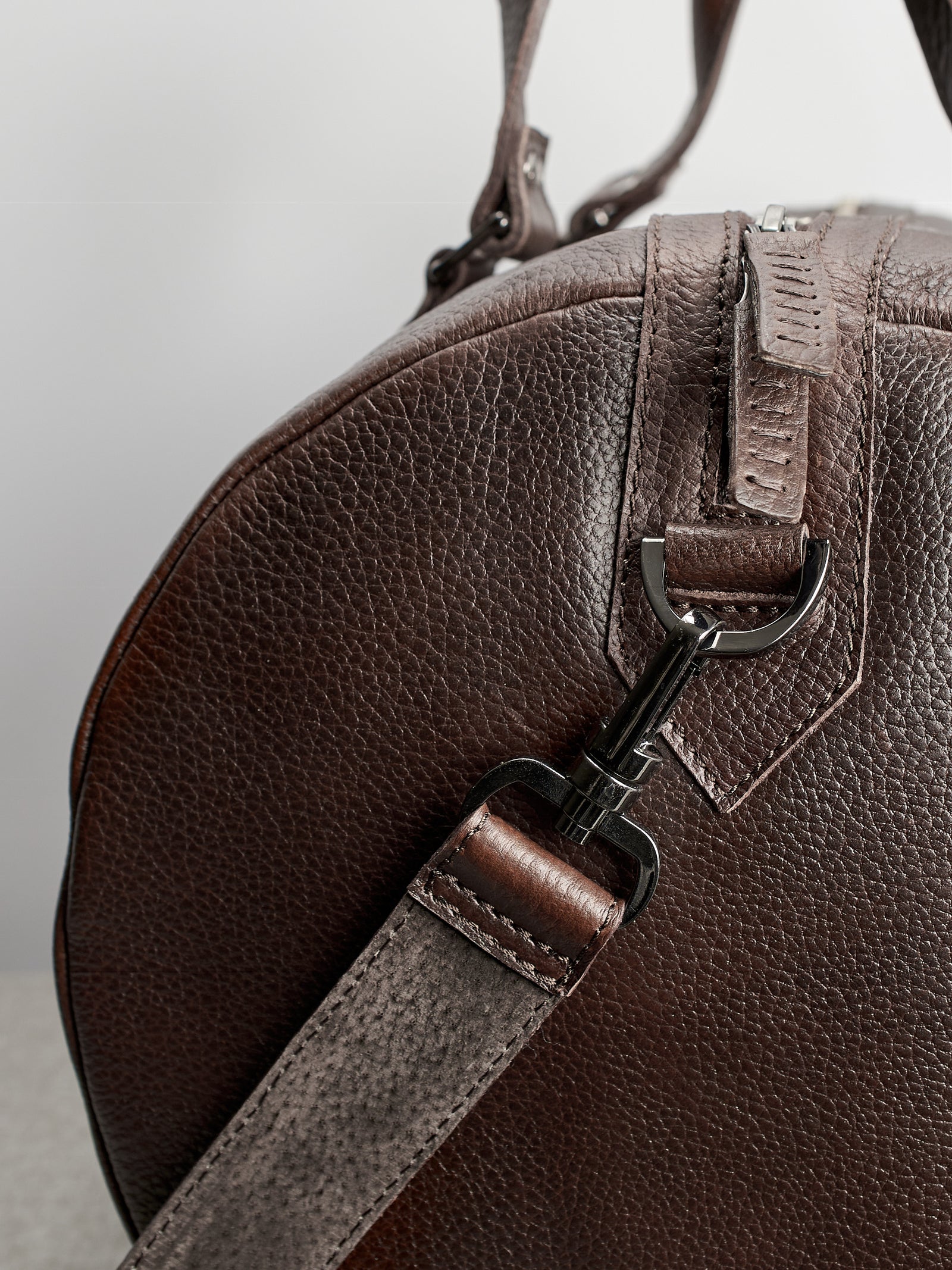 Carrying strap. Dark brown leather carryall bag. Mens travel weekender bag