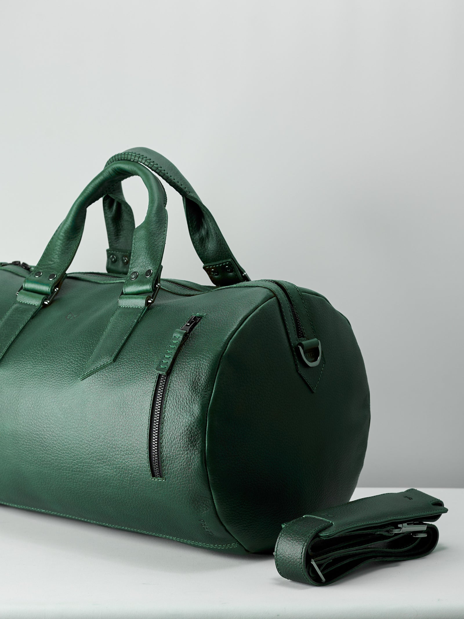 Style. Green designer leather weekender bag for men. Carryall shoulder bag