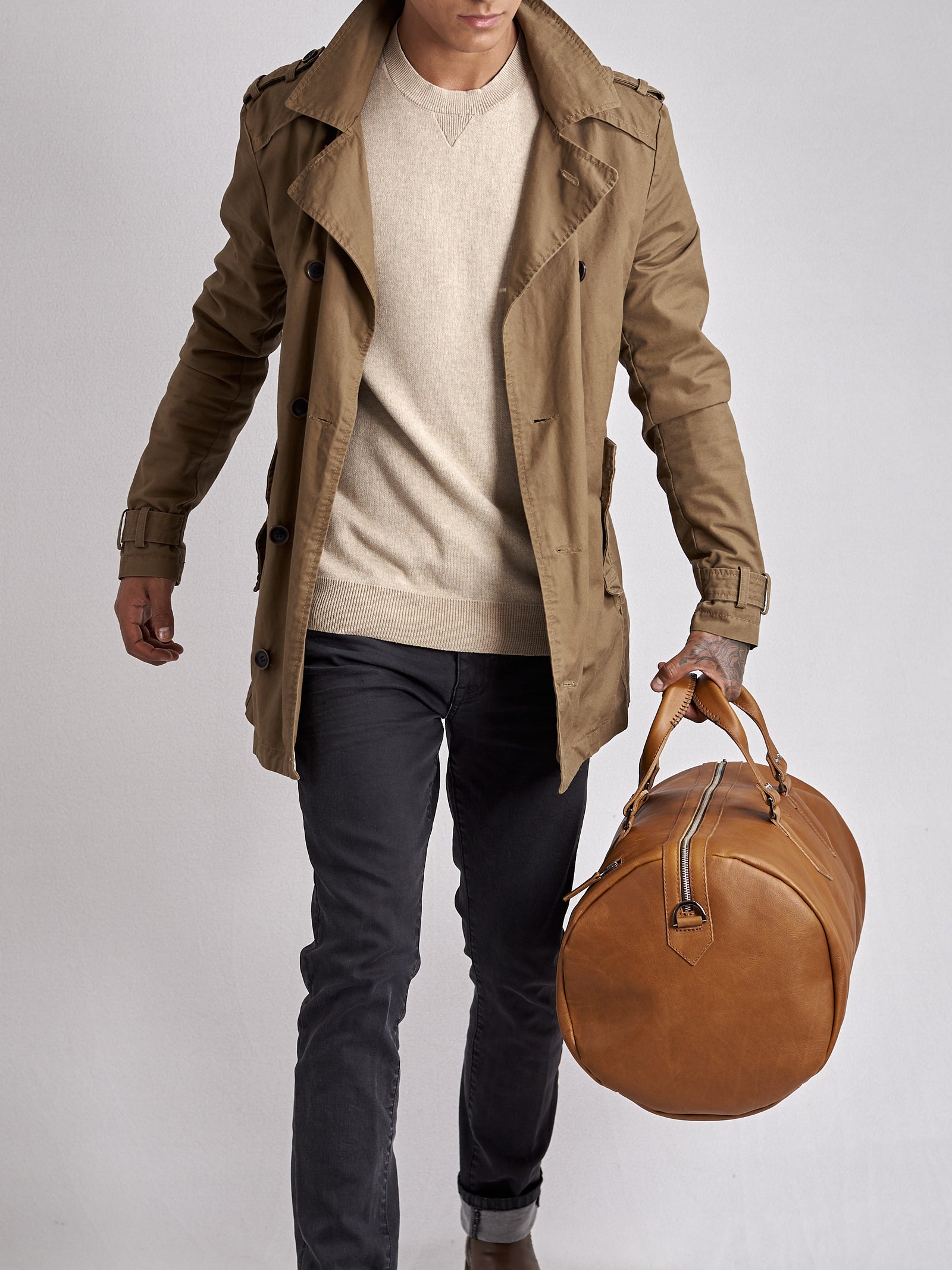 Substantial duffle bag tan by Capra Leather. Style side carry.