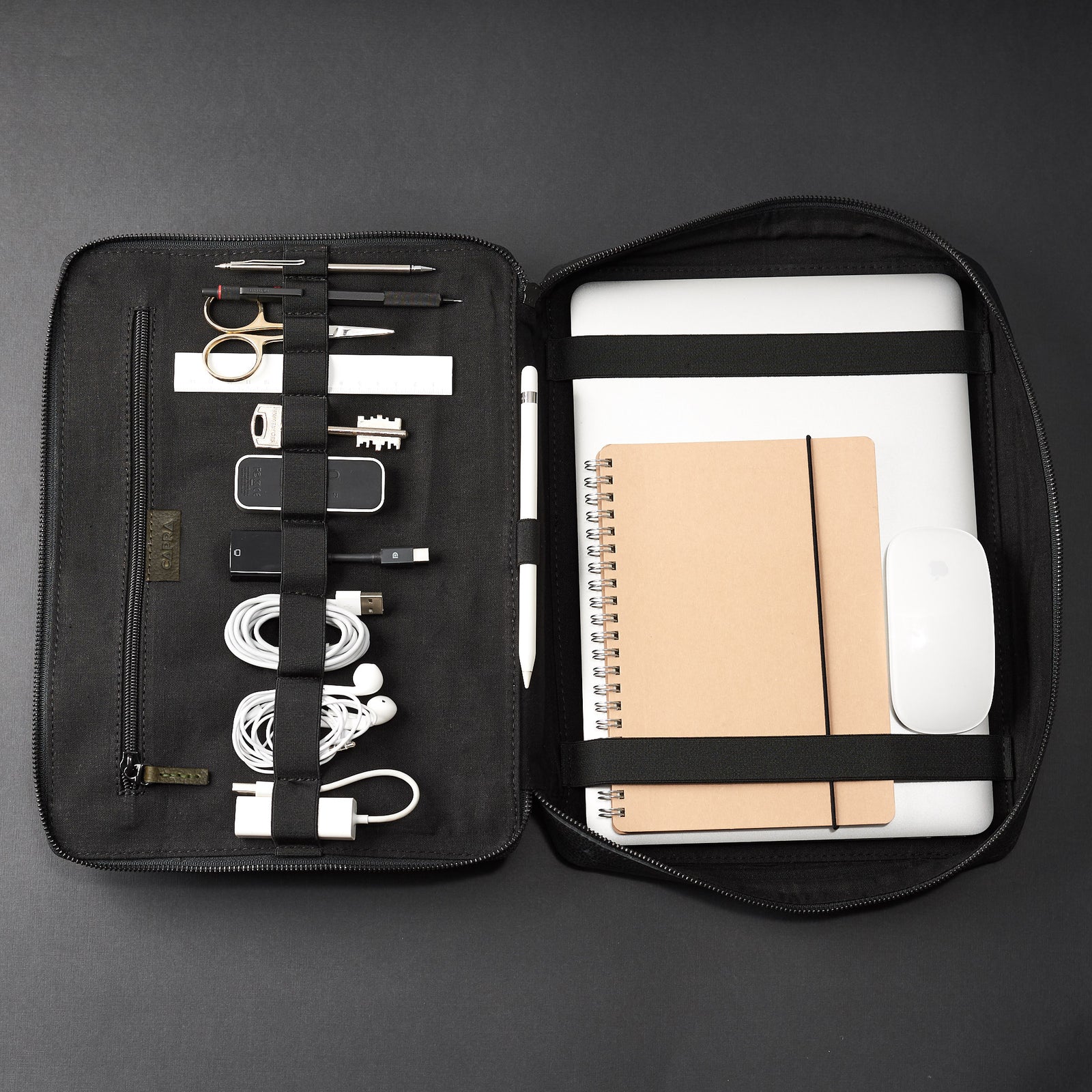Large size travel essentials. Green tech pouch by Capra Leather. Business travel electronics case.