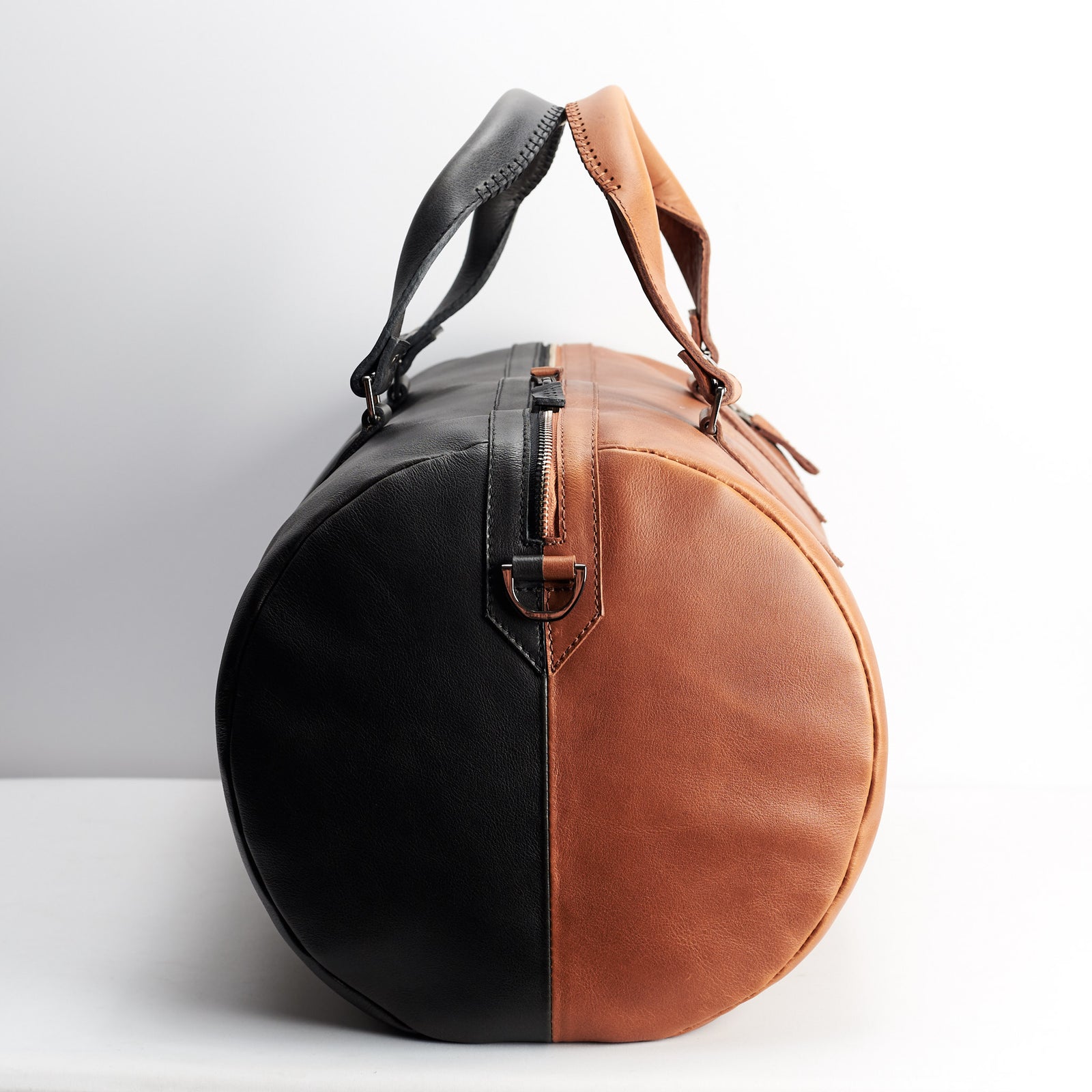 Double color. Double color men's duffle bag. Limited edition designer product. Unique weekender for travel.