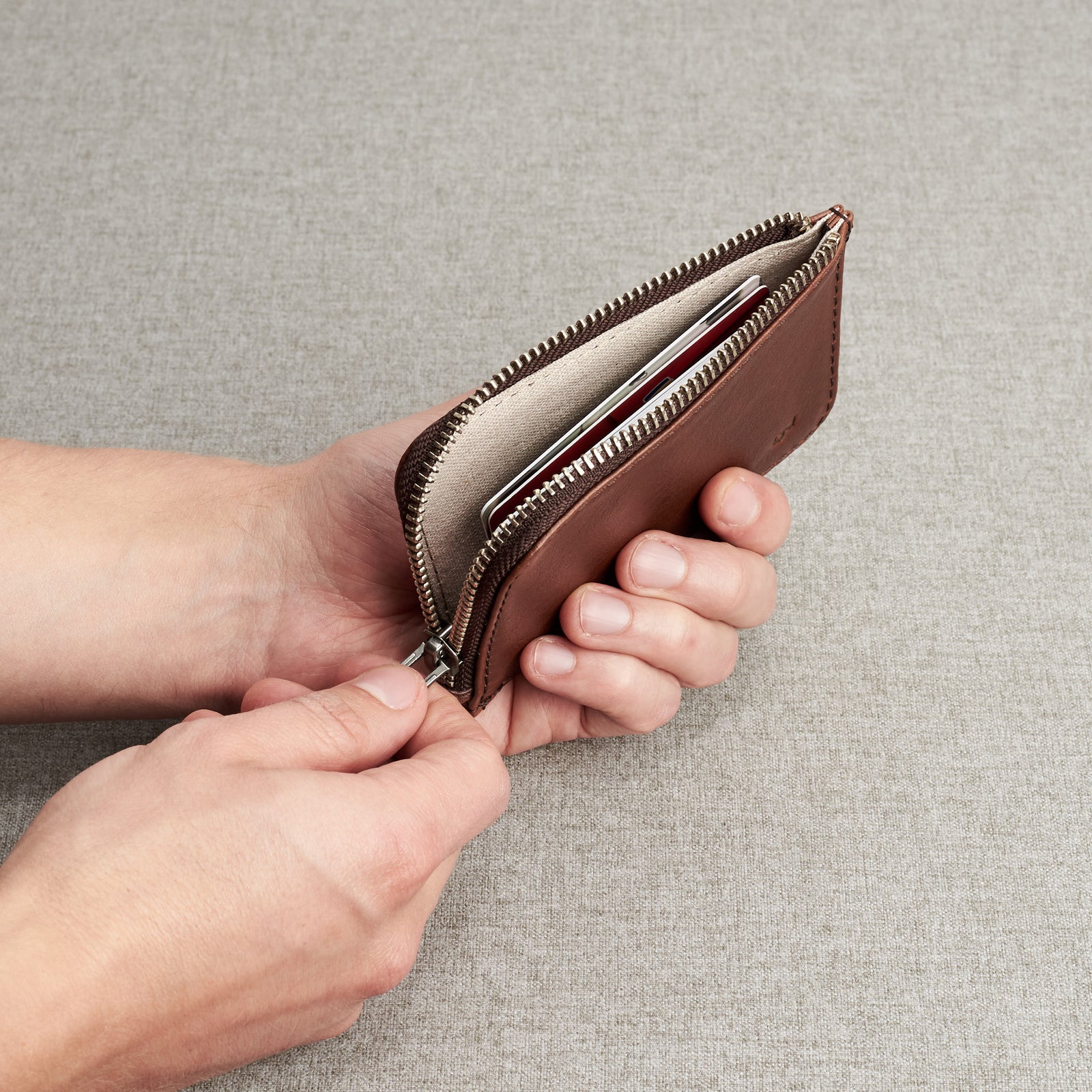 Designer cards pouch. Minimalist brown zipper card holder. Men's bills and coins wallet. Slim designer credit cards holder