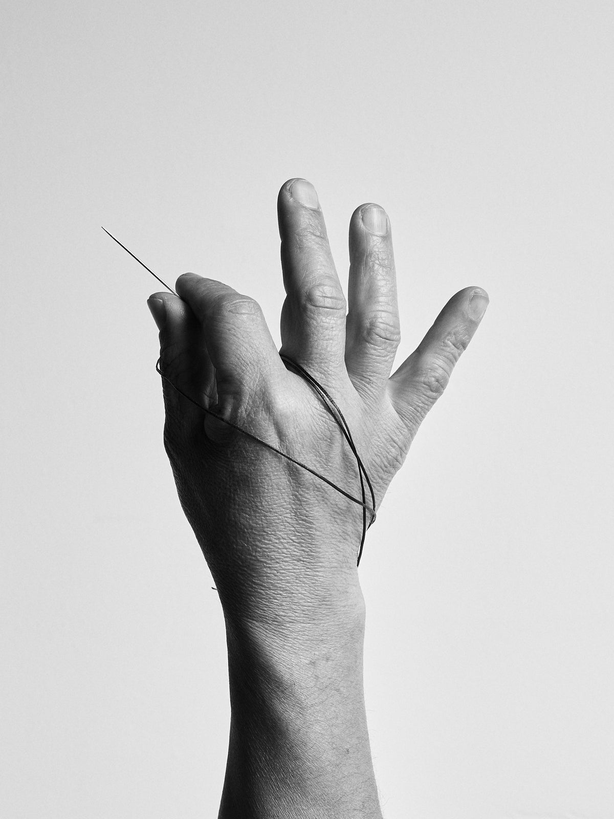 Hands of Ramiro Bravo, Artisan at Capra Leather in Bogotá