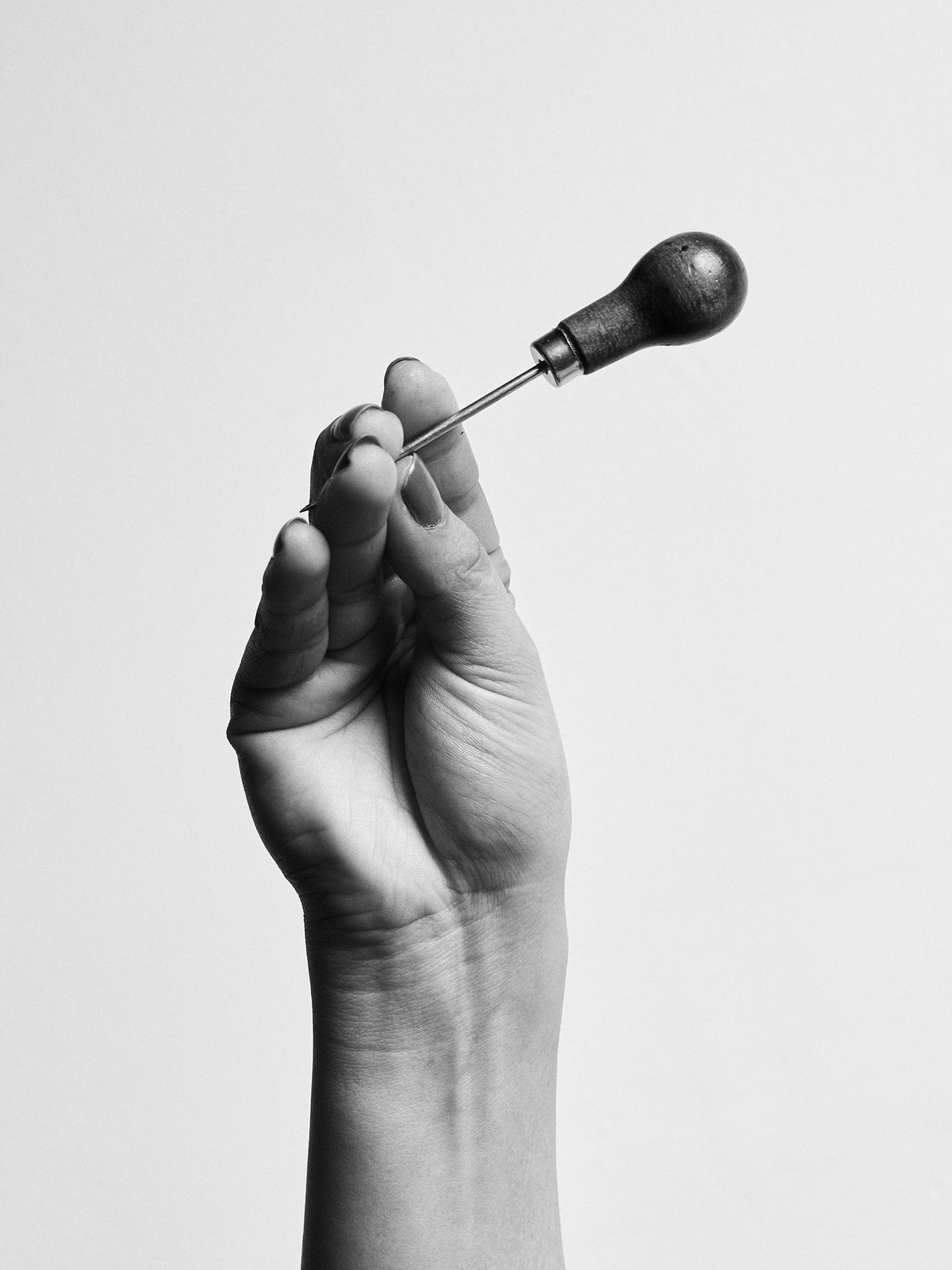Hands of Ximena Tintinago, Artisan at Capra Leather in Bogotá