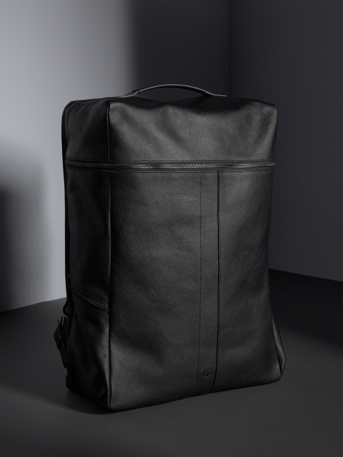 Front view of the black full-grain leather Capra Leather Banteng backpack, highlighting the sleek, minimalist design.