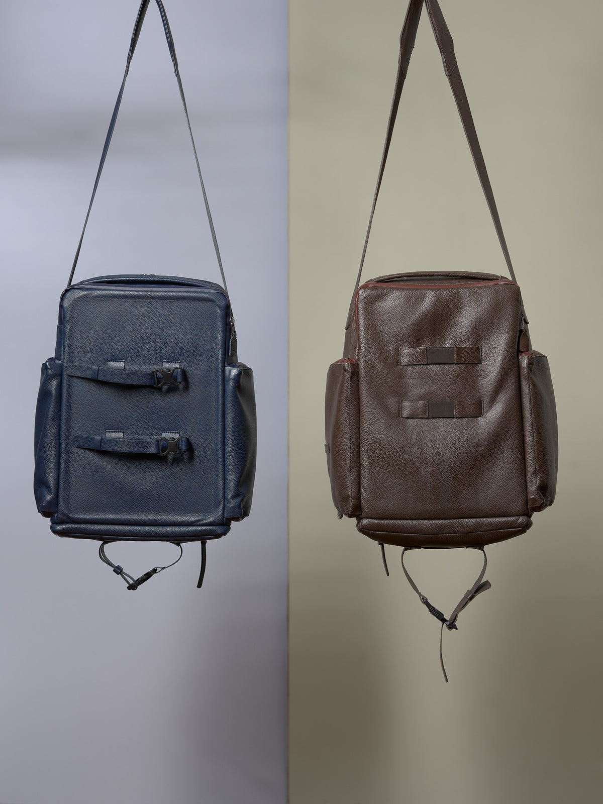 Capra Leather Bike Rack Bag in blue and dark brown leather, showcasing shoulder strap and pannier attachments.