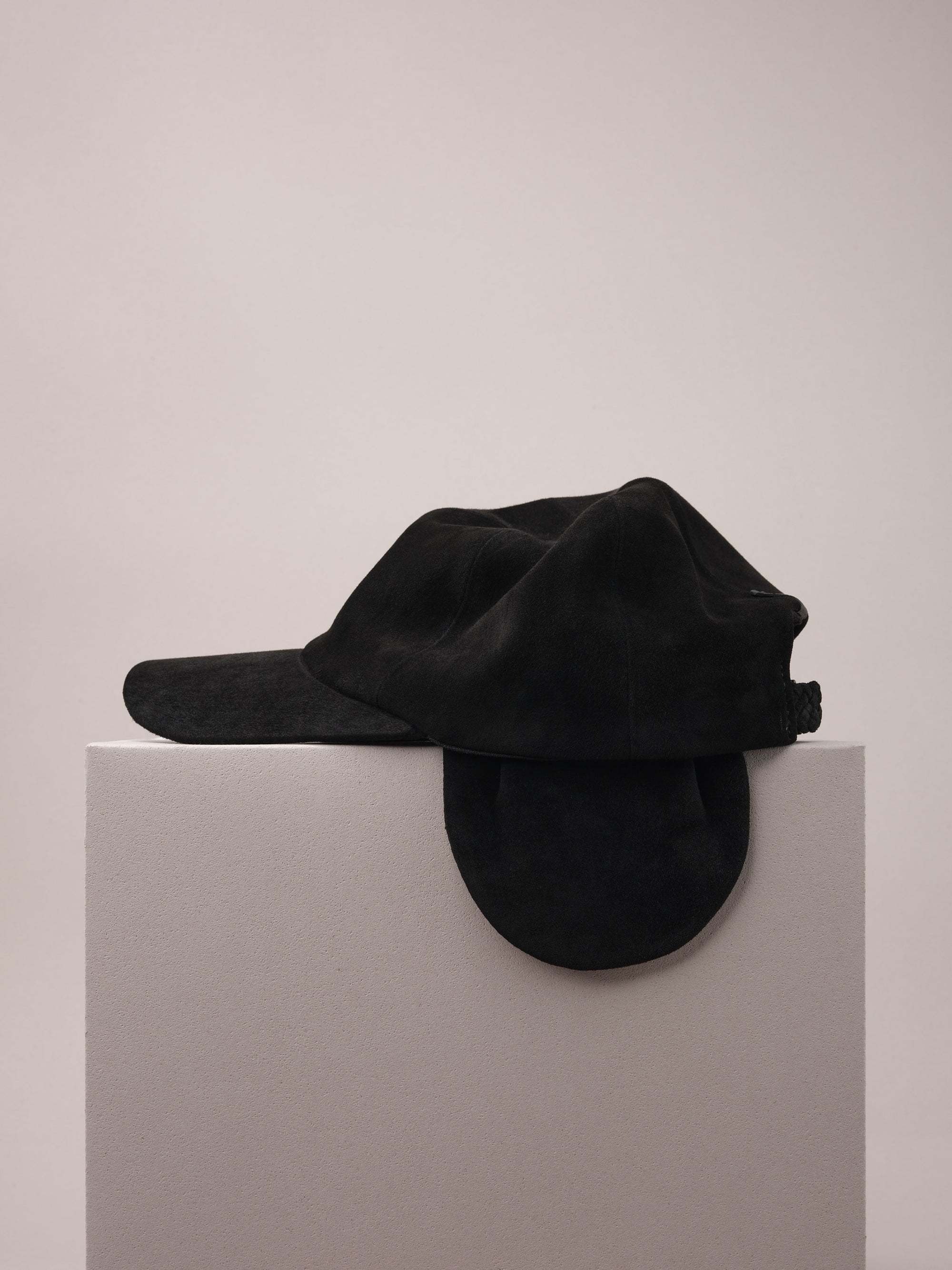 Black Suede Cap with Removable Ear Flaps.