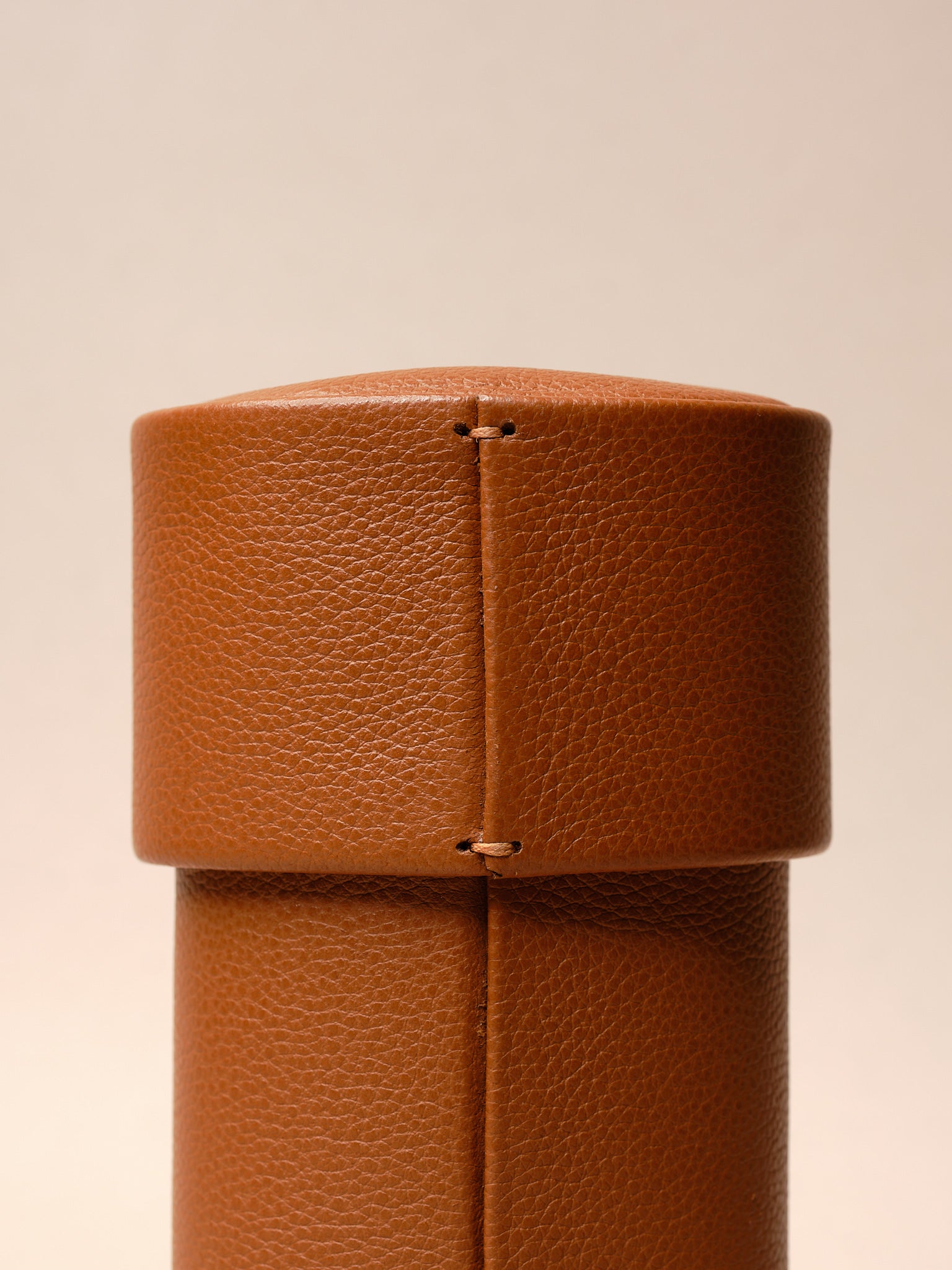 A high-quality, handcrafted leather travel case for watches, glasses, and jewelry.