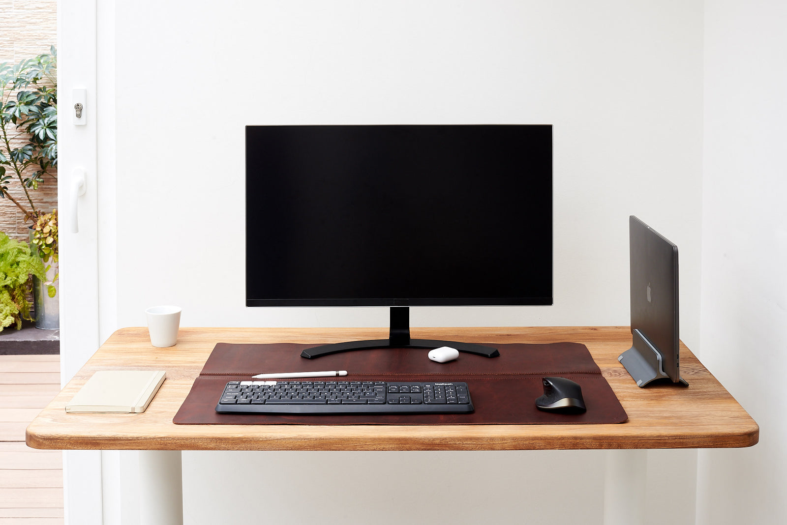 Smooth leather desk pad, perfect for any modern setup.