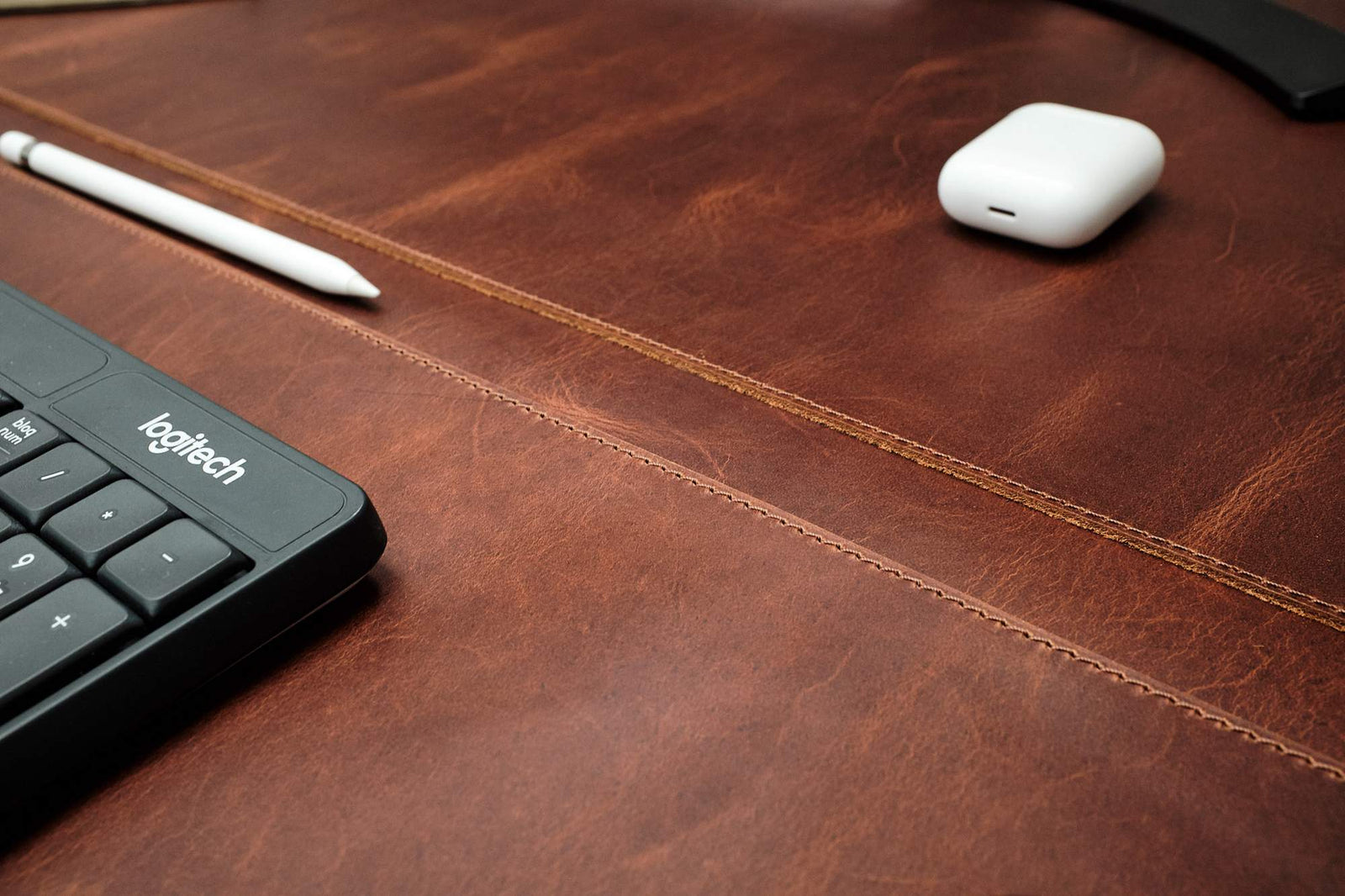 Leather desk pad with an optional pen slot.