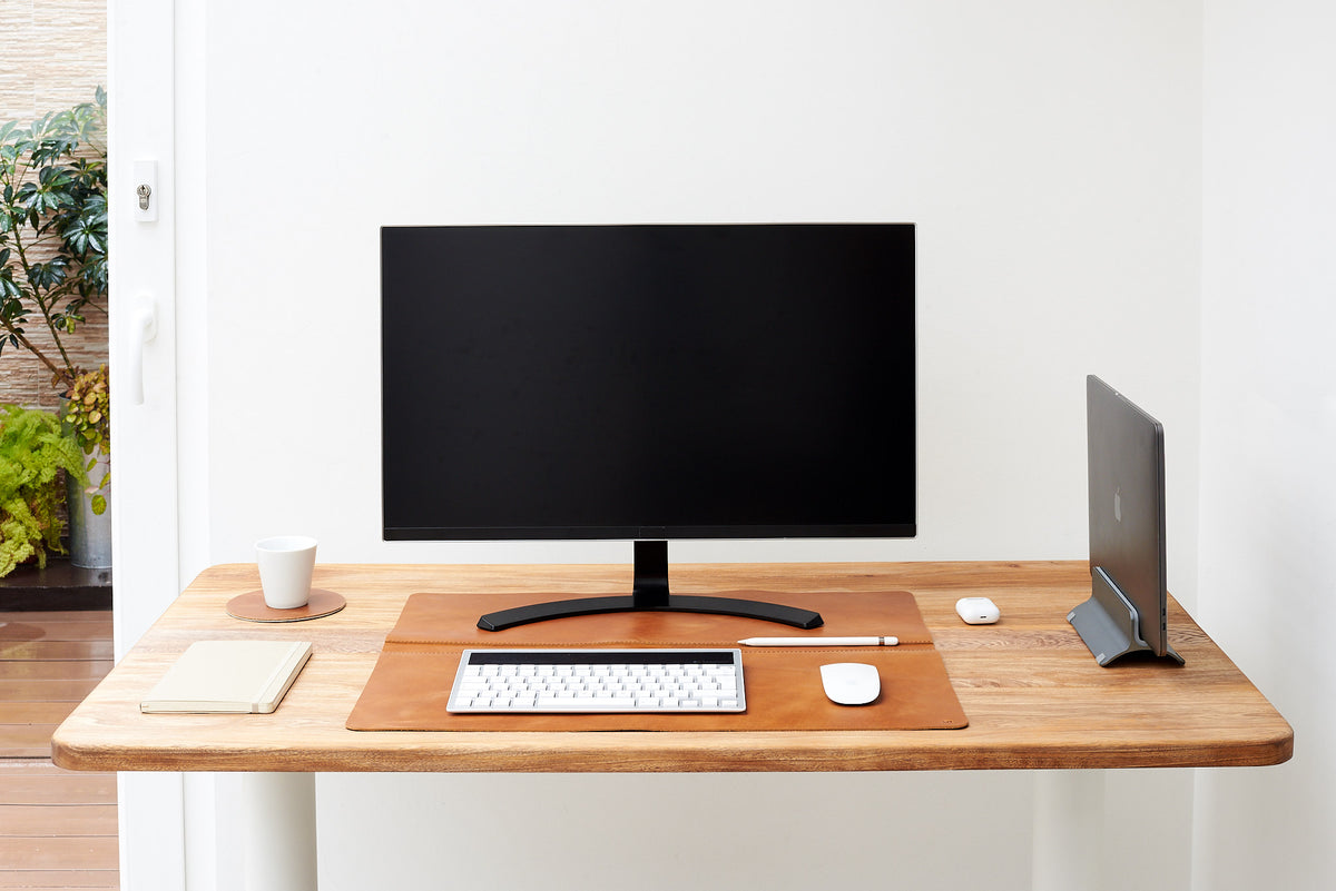 Durable leather desk mat to enhance productivity.