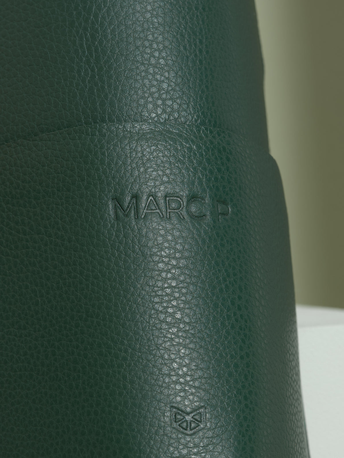 Green leather glasses case with a custom "marc p" monogram, a thoughtful personalized gift for men.