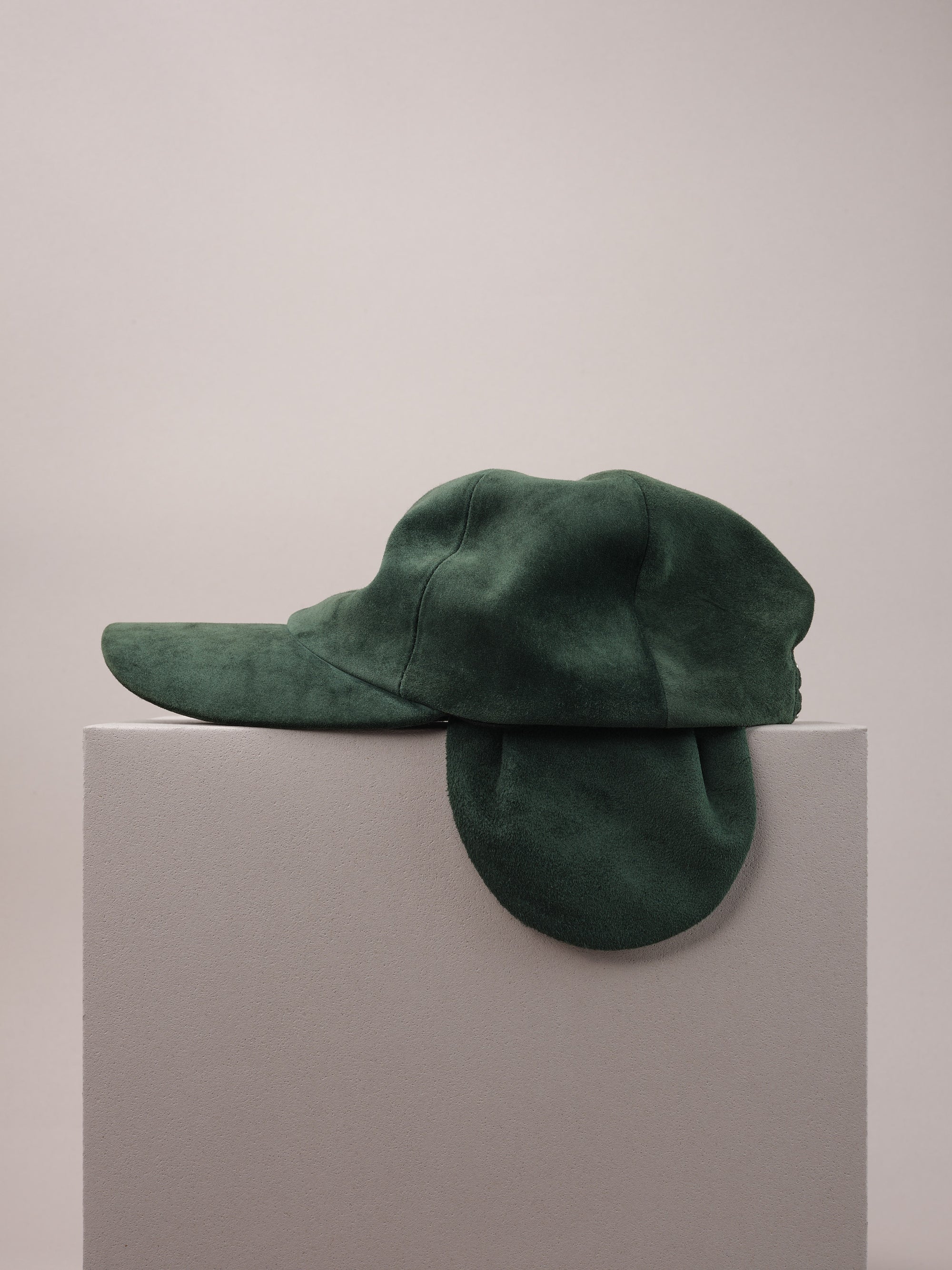 Green Suede Cap with Removable Ear Flaps.