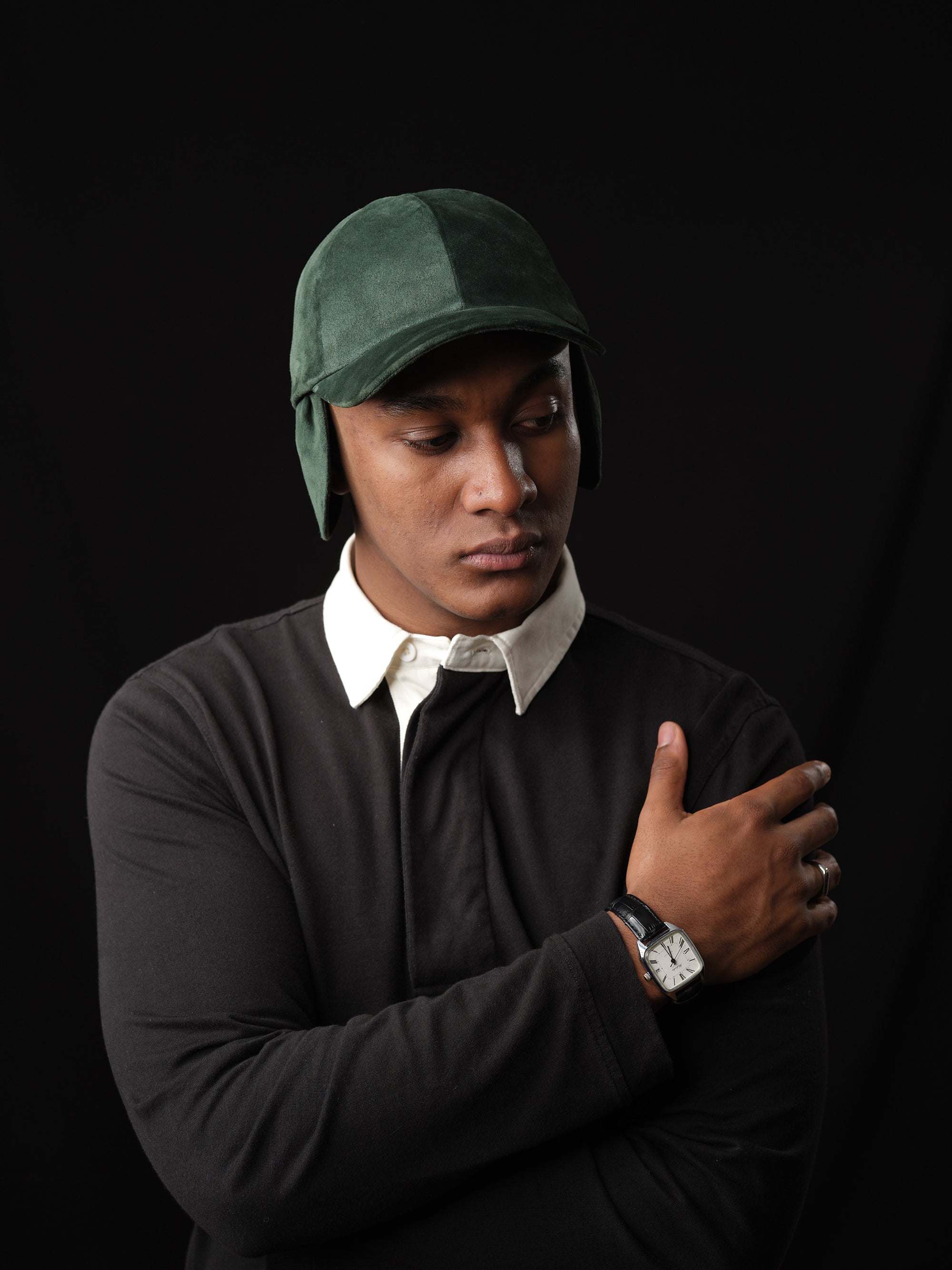 Man wearing a green suede baseball cap by Capra Leather