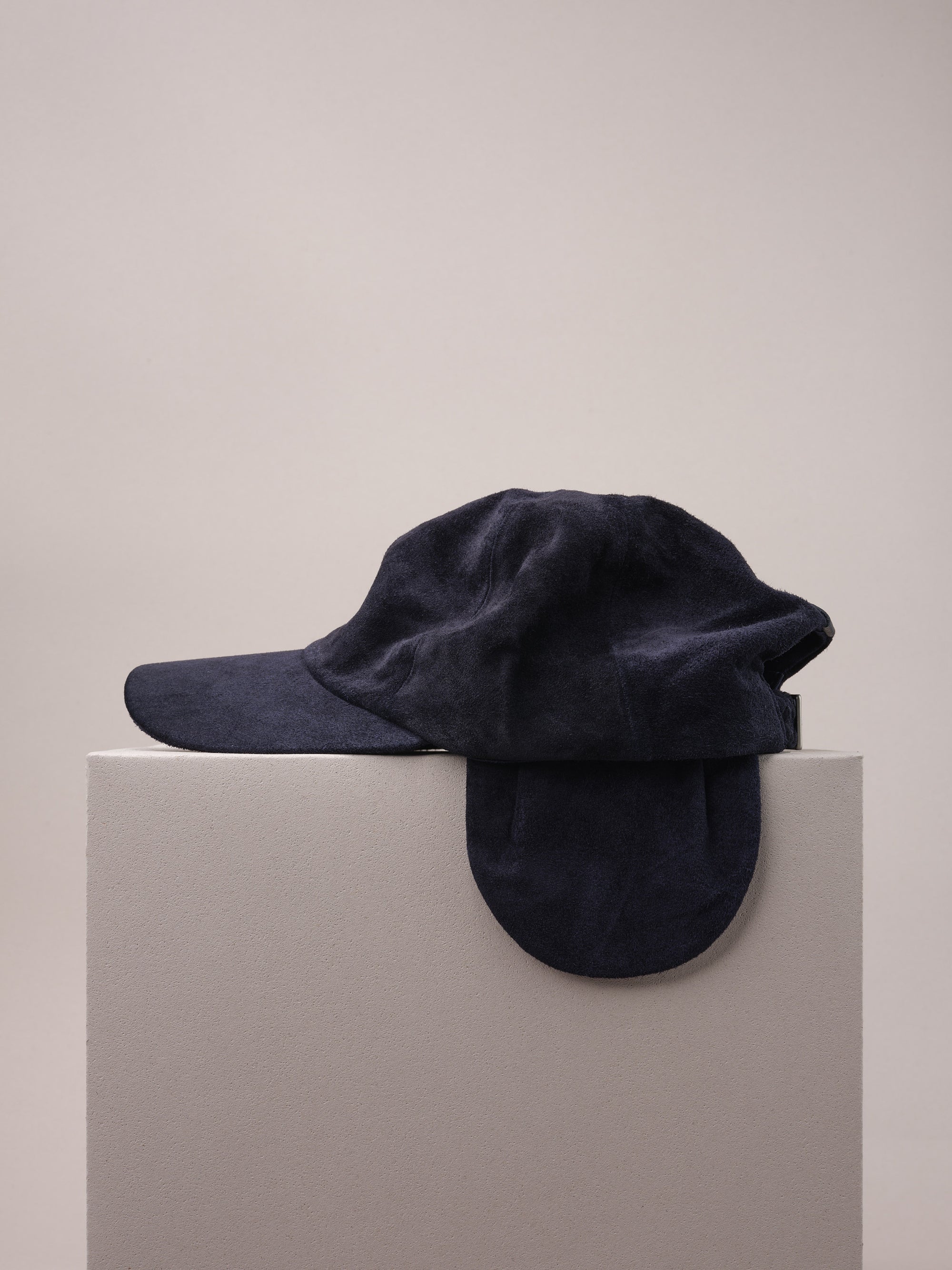 Navy Suede Cap with Removable Ear Flaps.