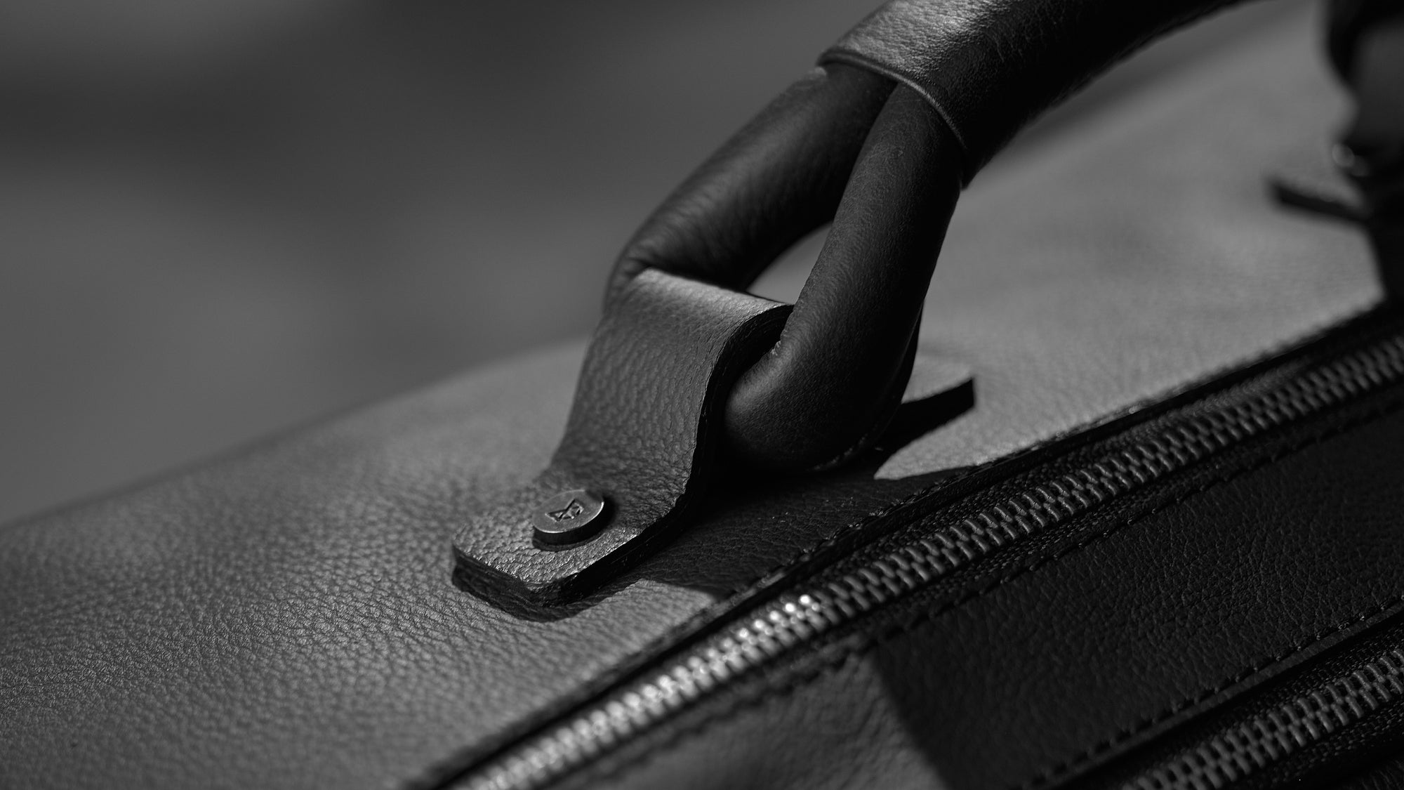 Hand stitched handle weekend bag by Capra Leather