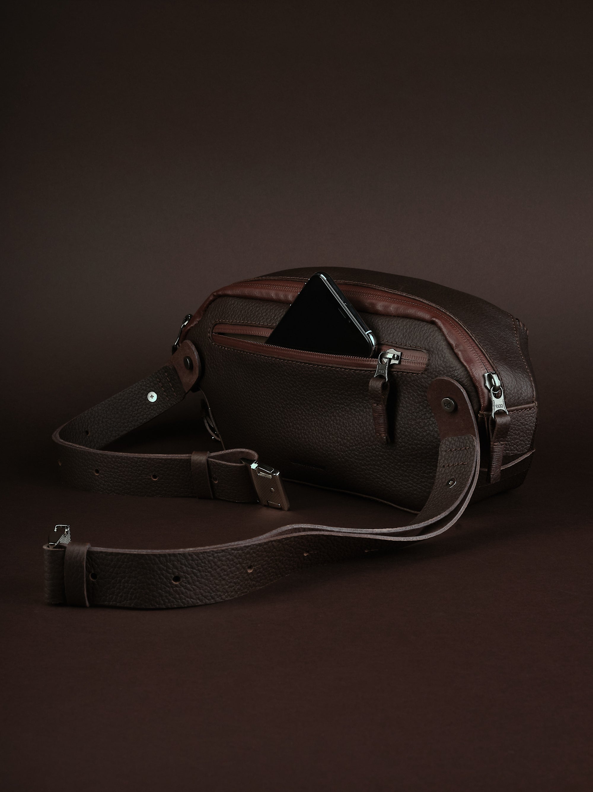 Easy access back pocket. Best Sling Bag Dark Brown by Capra Leather