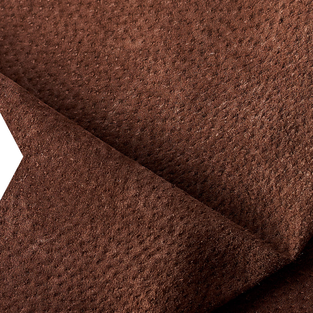 Close-up of brown pigskin suede, paired with full-grain leather in Capra Leather pieces